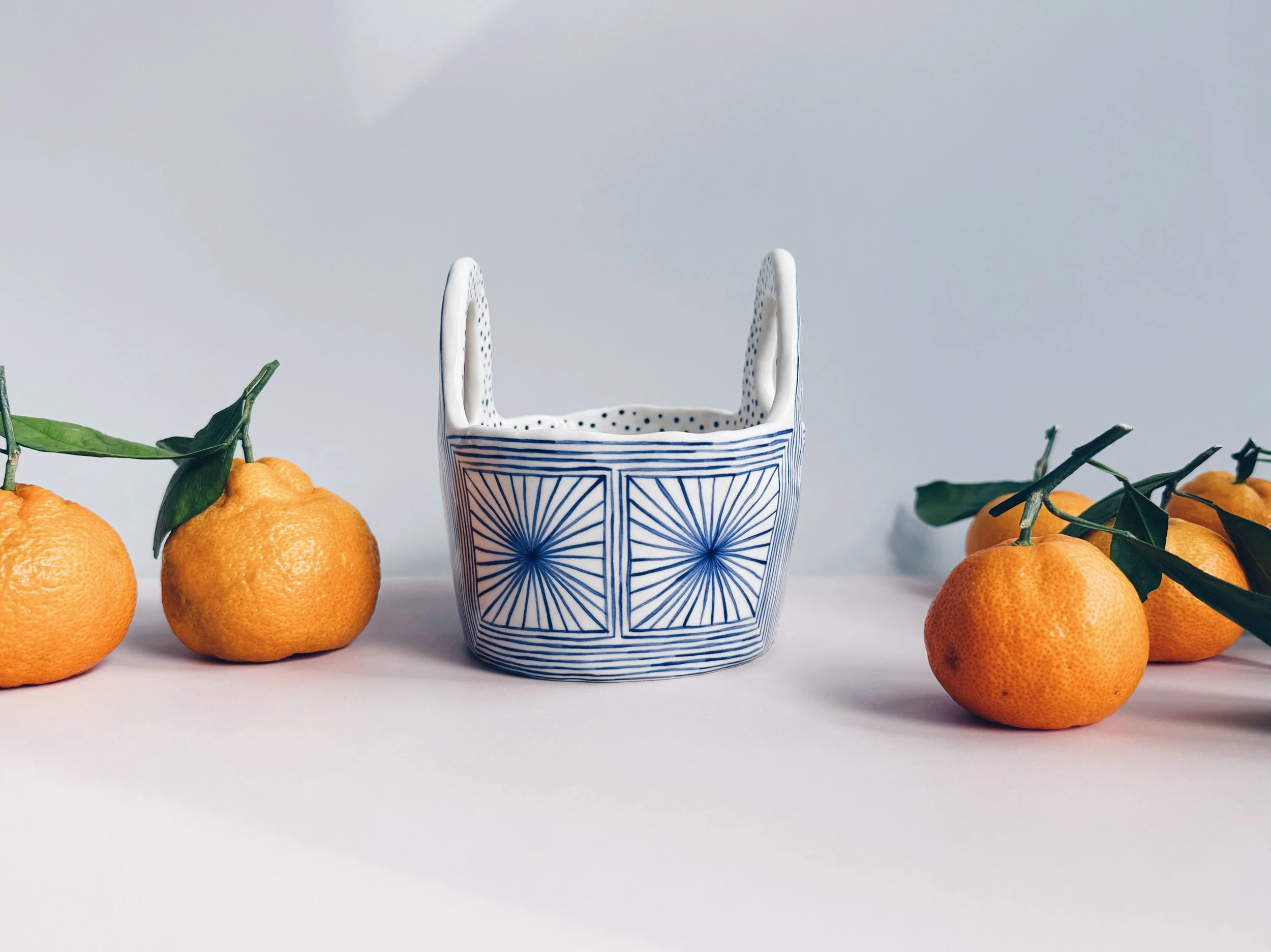 Blue and white, handmade ceramic vessel.