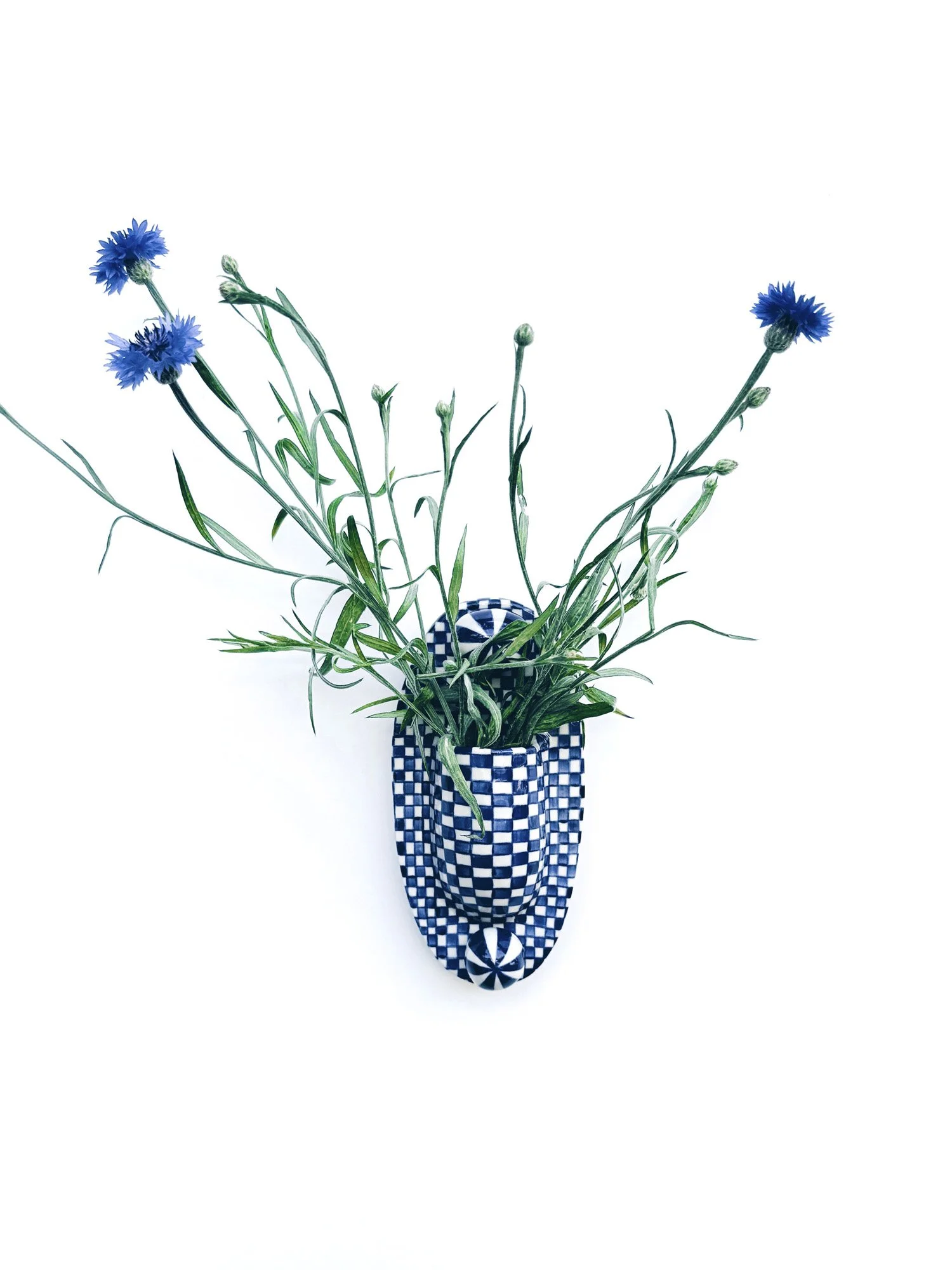 Blue and white, handmade ceramic wall hanging.