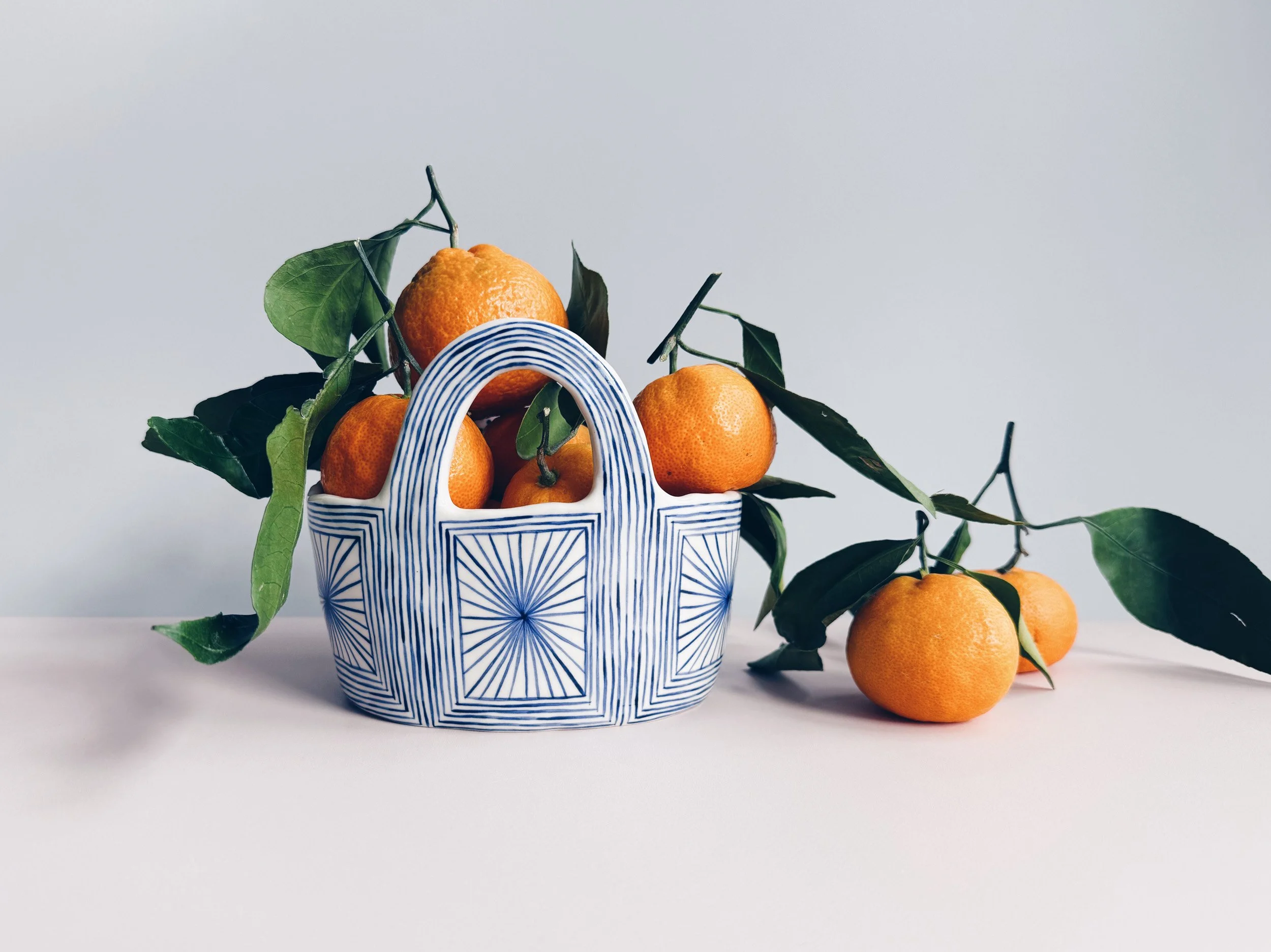Blue and white, handmade ceramic vessel.