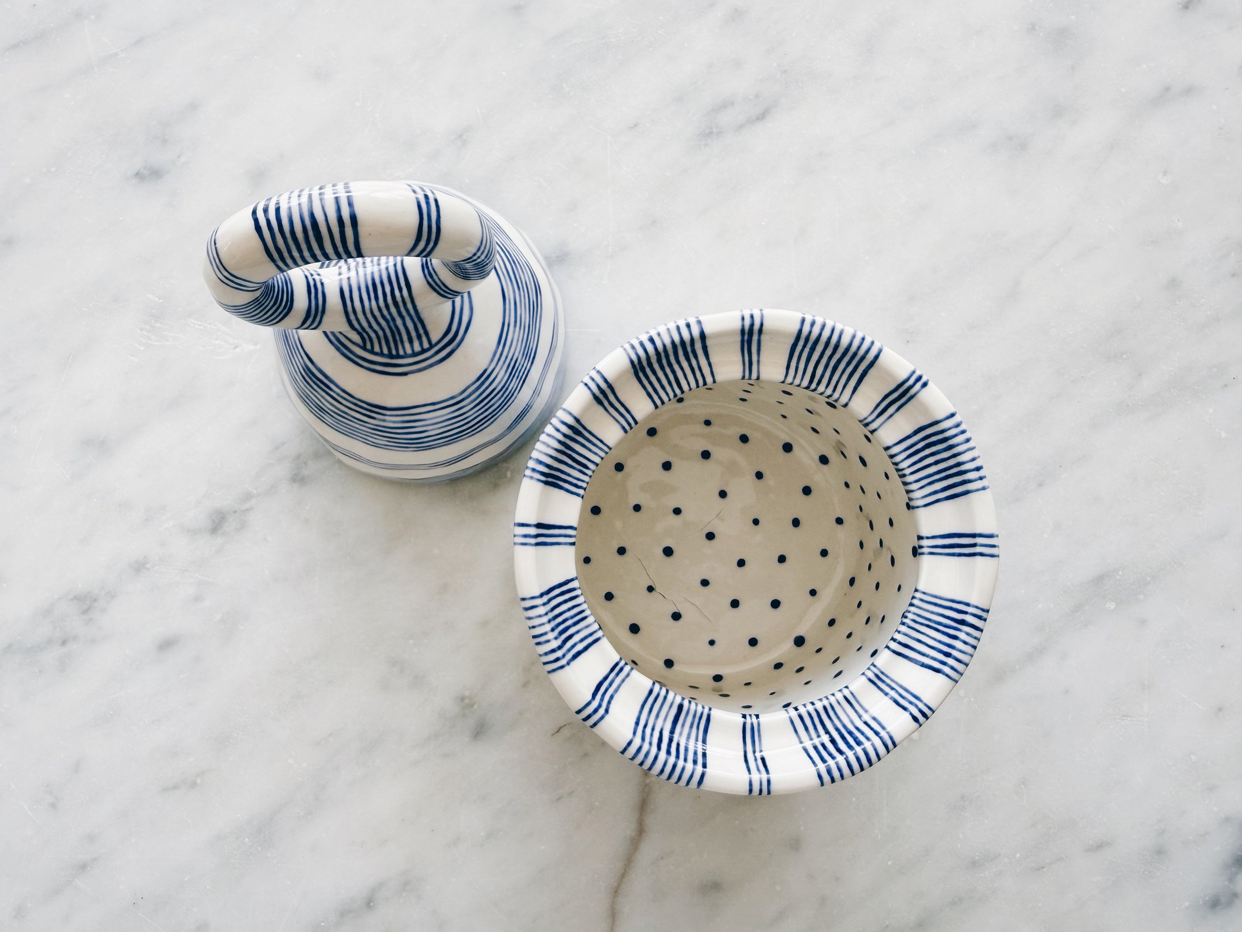 Blue and white, handmade ceramic jar.
