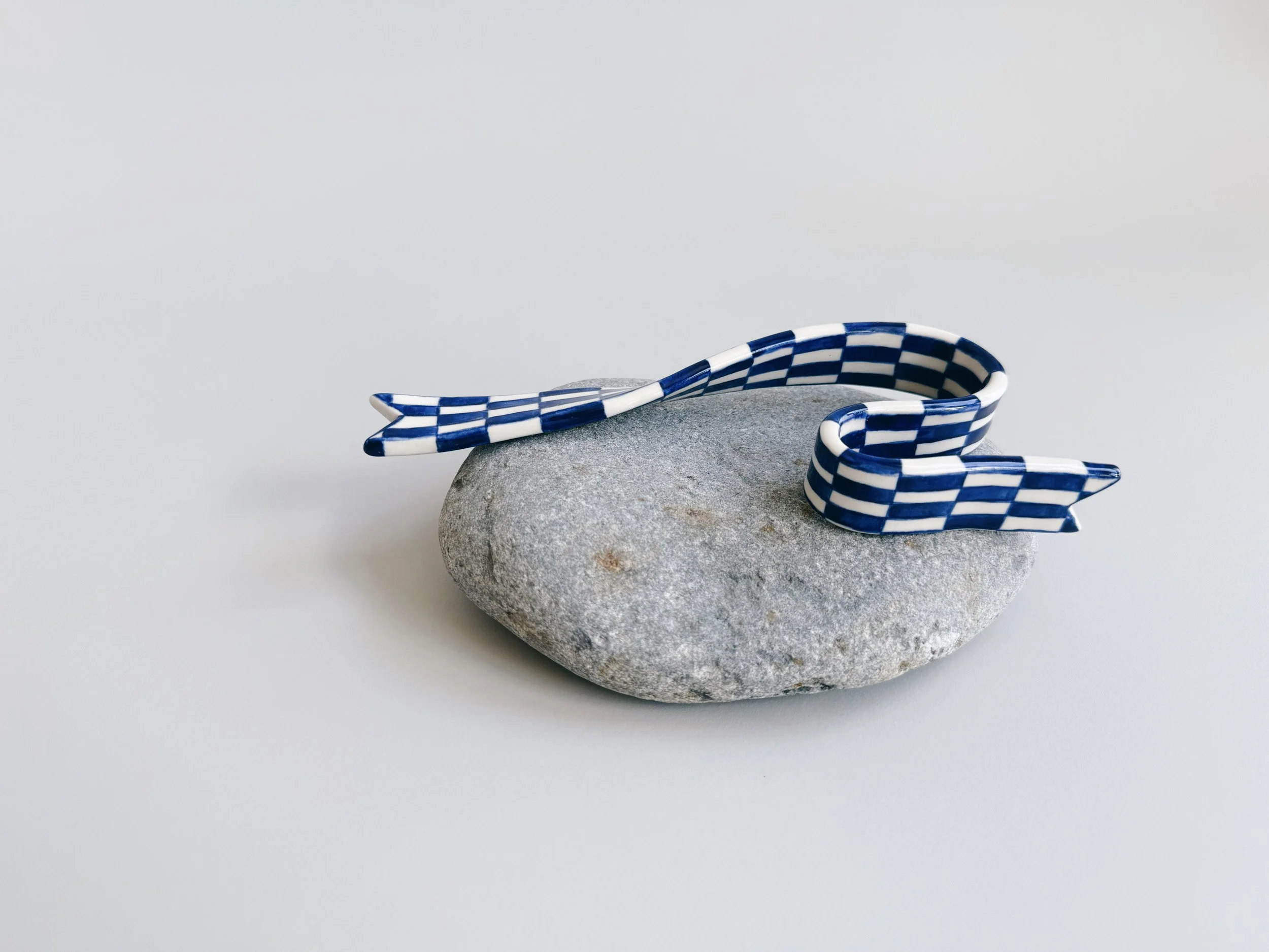 Blue and white, handmade ceramic ribbon