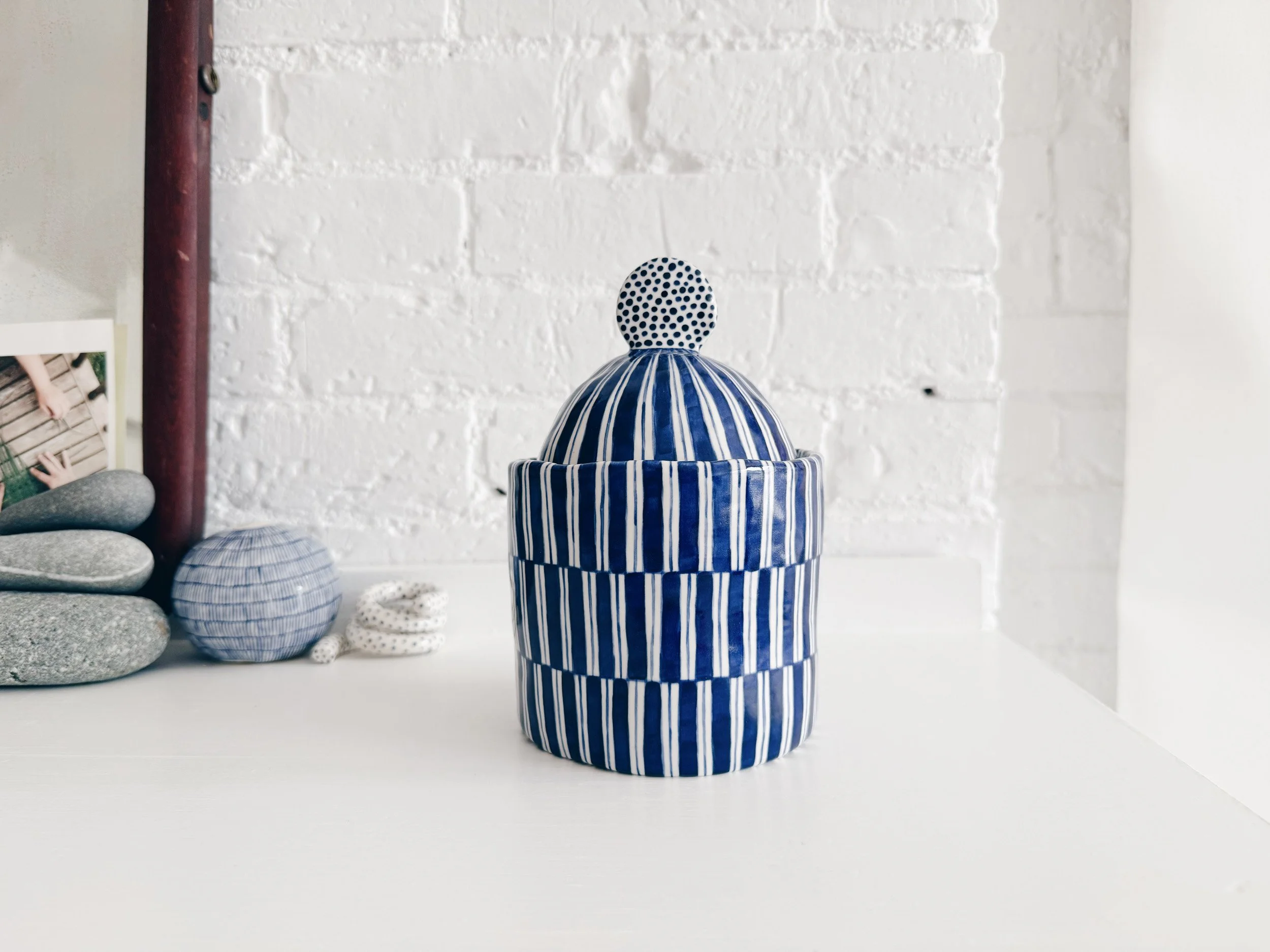 Blue and white, handmade ceramic jar.