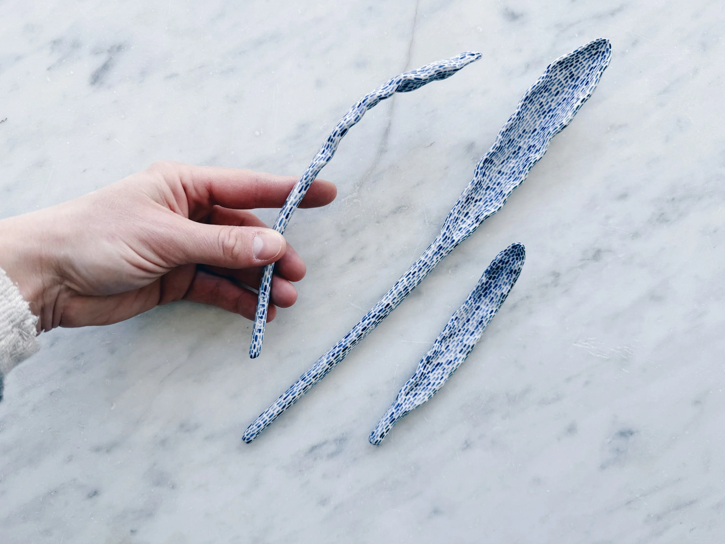 Blue and white, handmade ceramic sculpture.