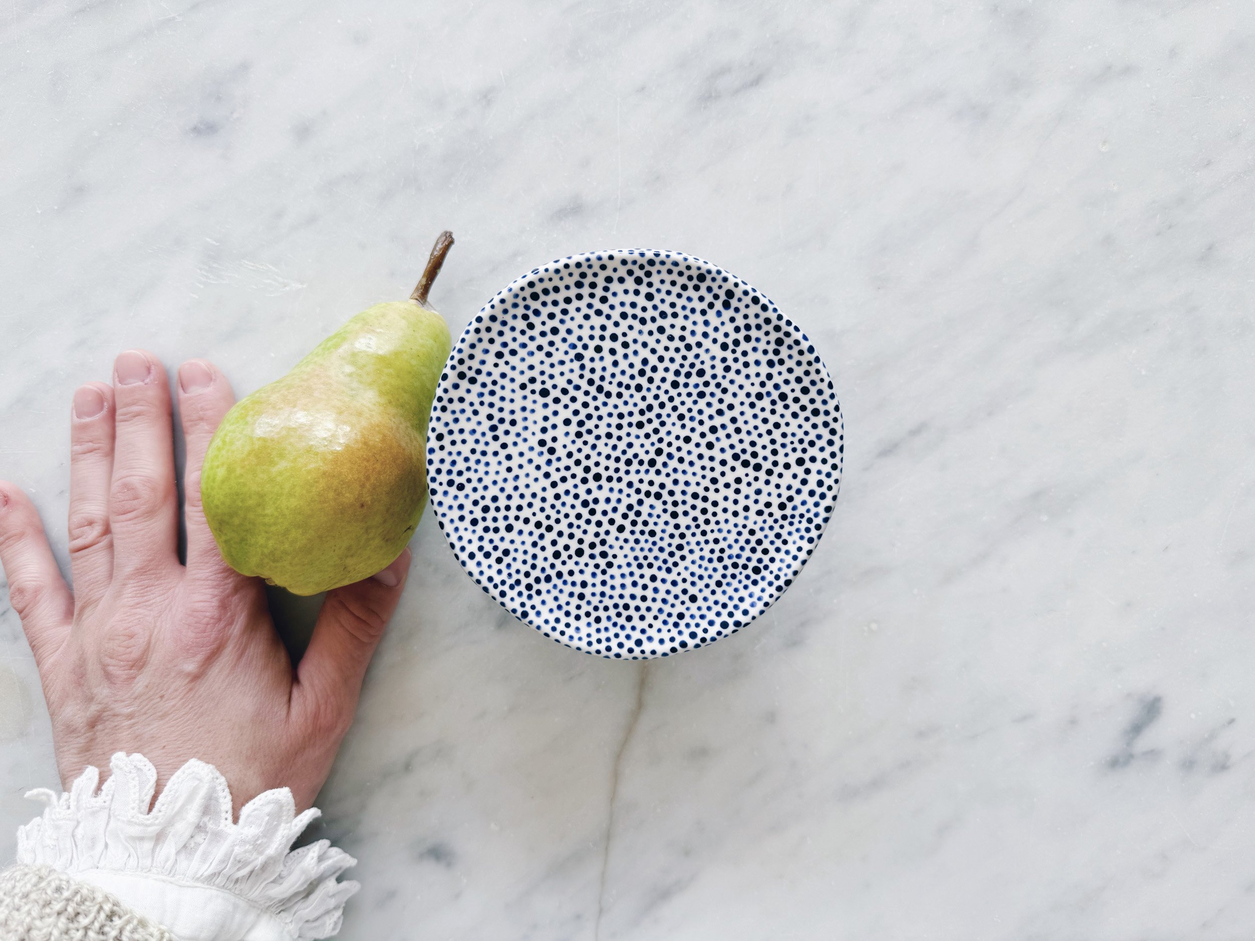 Blue and white, handmade ceramic raised plate.