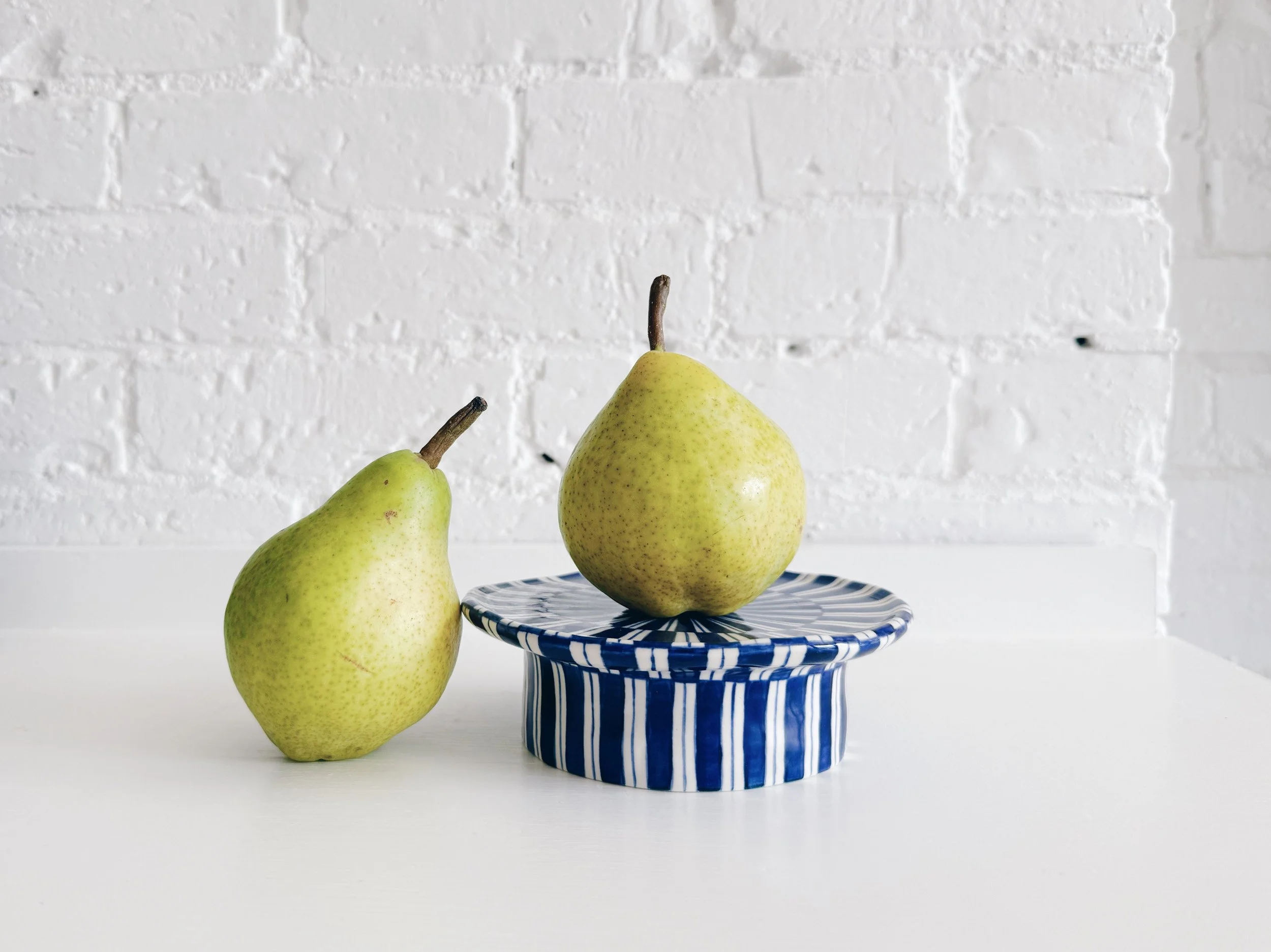 Blue and white, handmade ceramic raised plate.