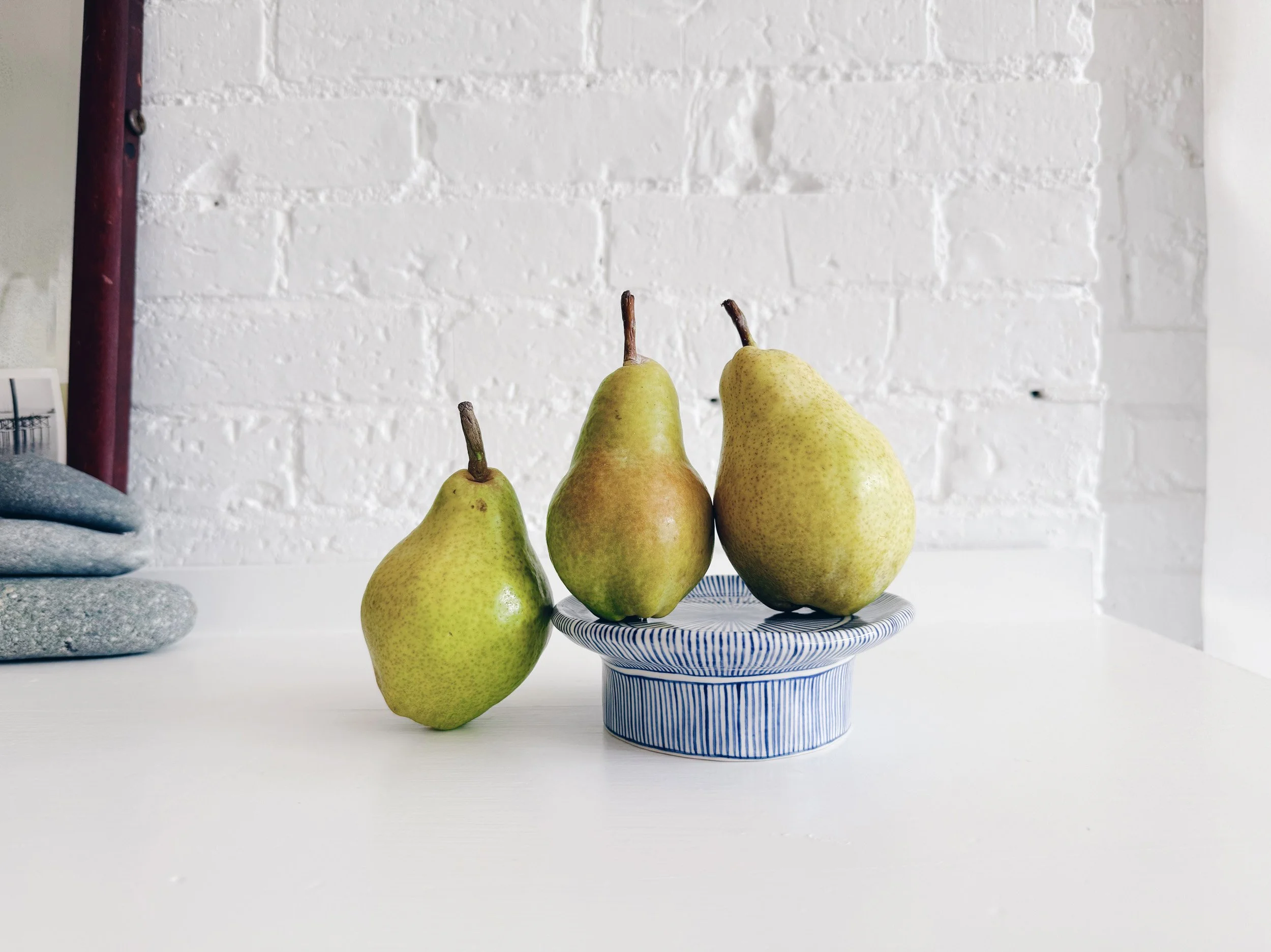 Blue and white, handmade ceramic raised plate.