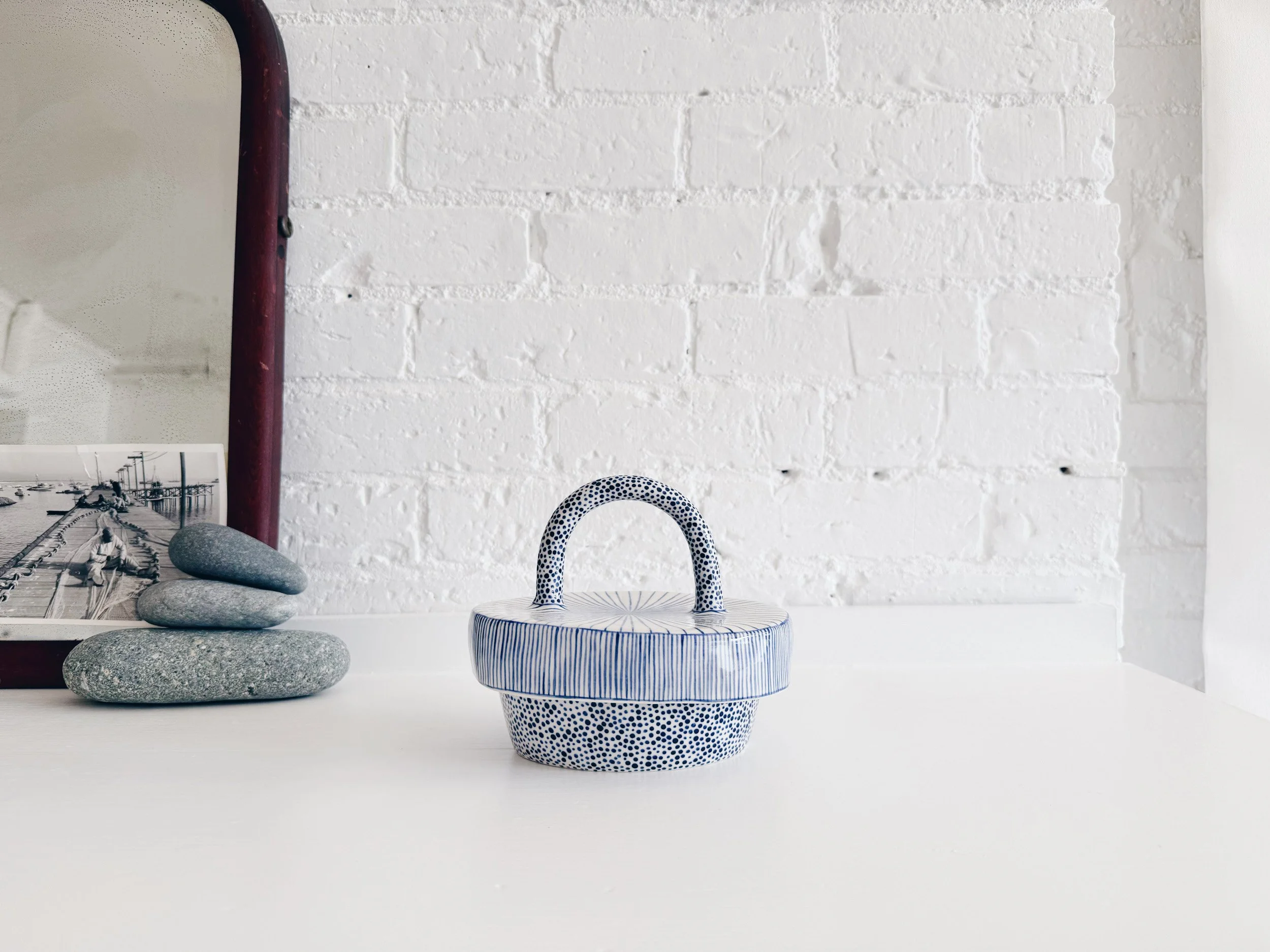 Blue and white, handmade ceramic jar.