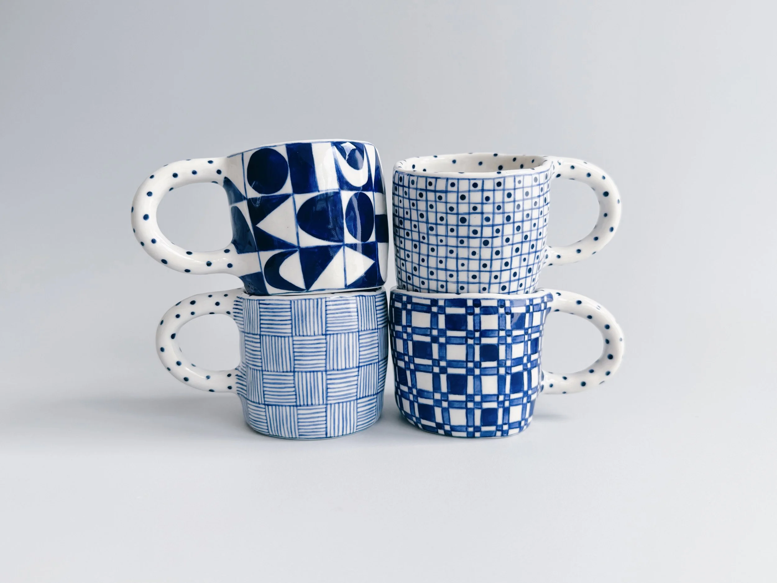 Blue and white, handmade ceramic mug.