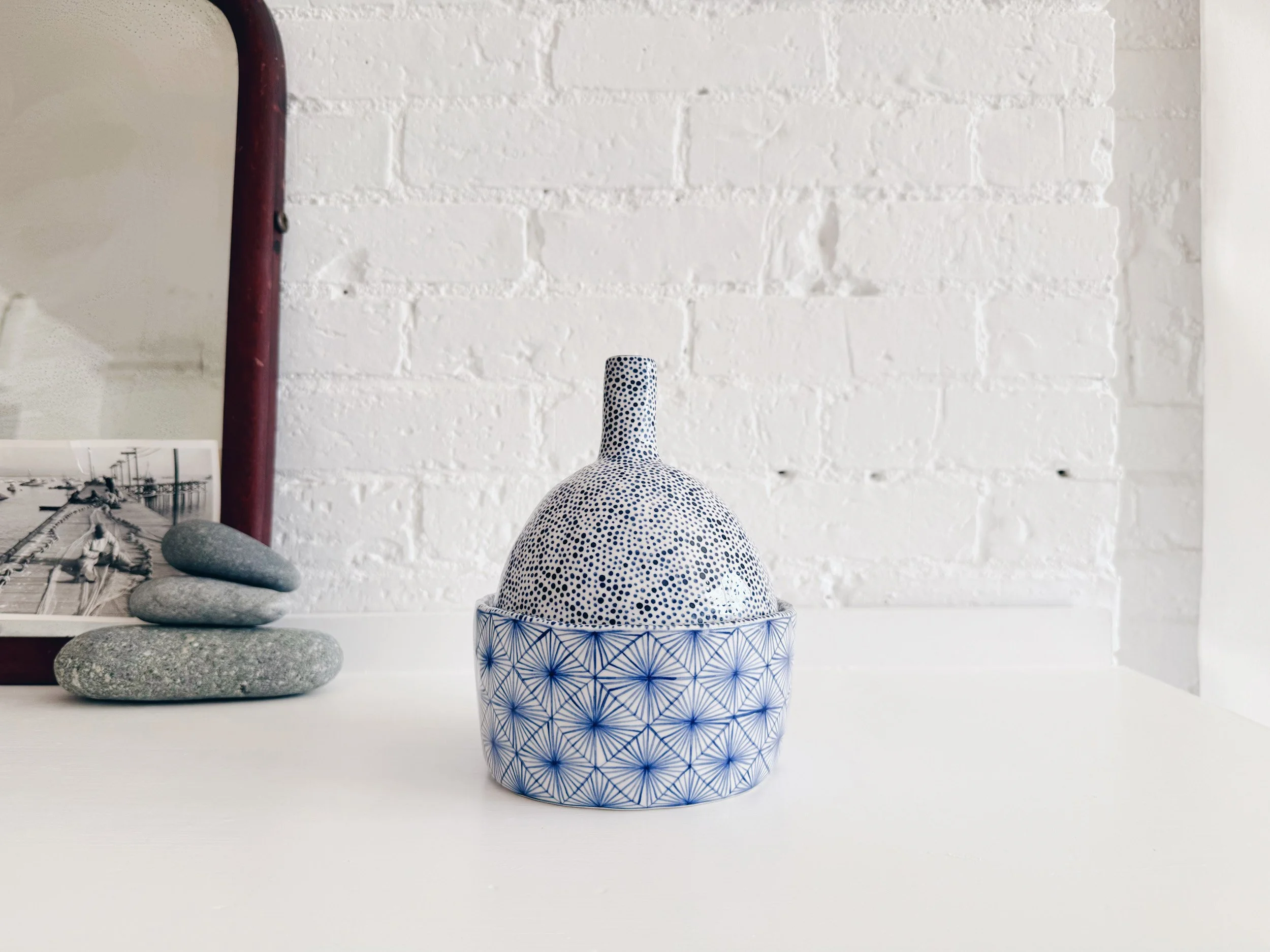 Blue and white, handmade ceramic jar.