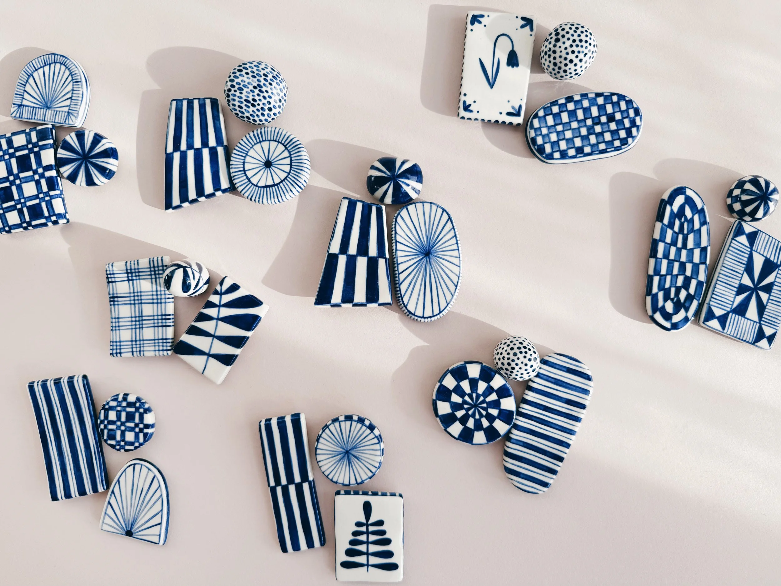 Blue and white, handmade ceramic magnets.