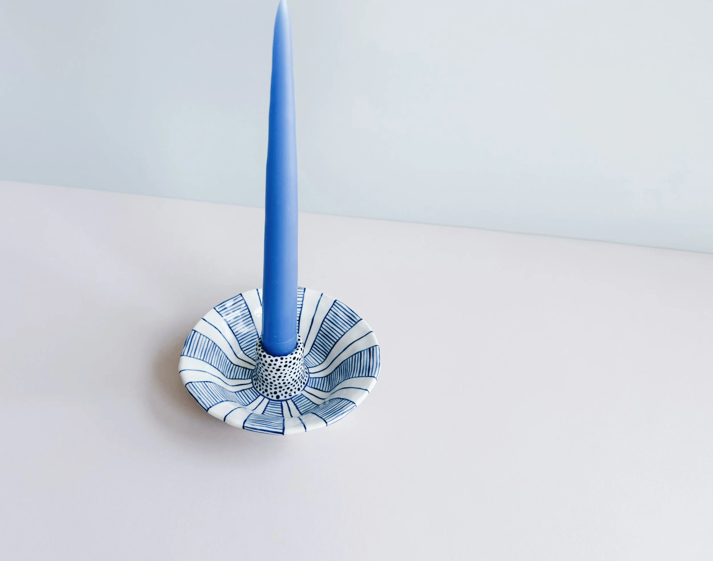 Blue and white, handmade ceramic candleholder.
