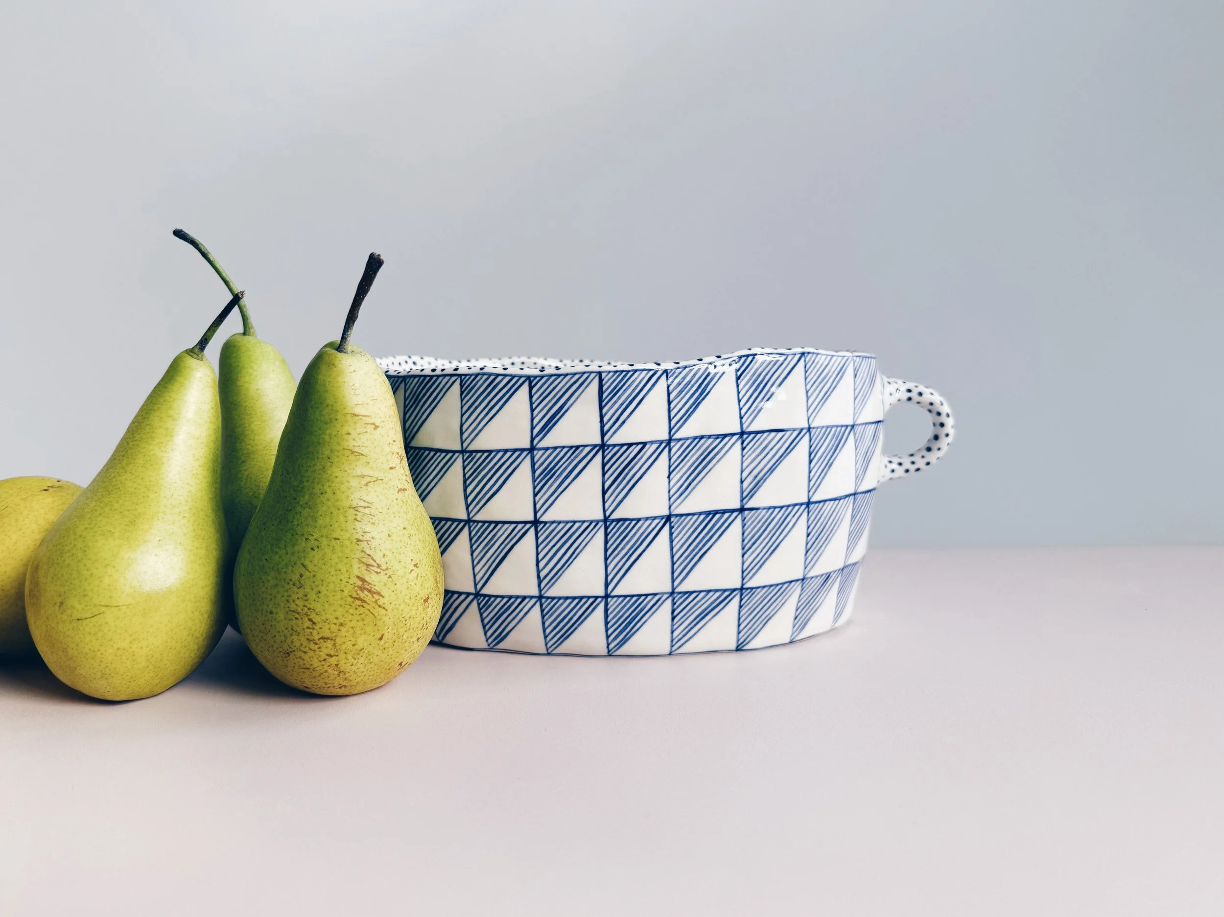 Blue and white, handmade ceramic vessel.