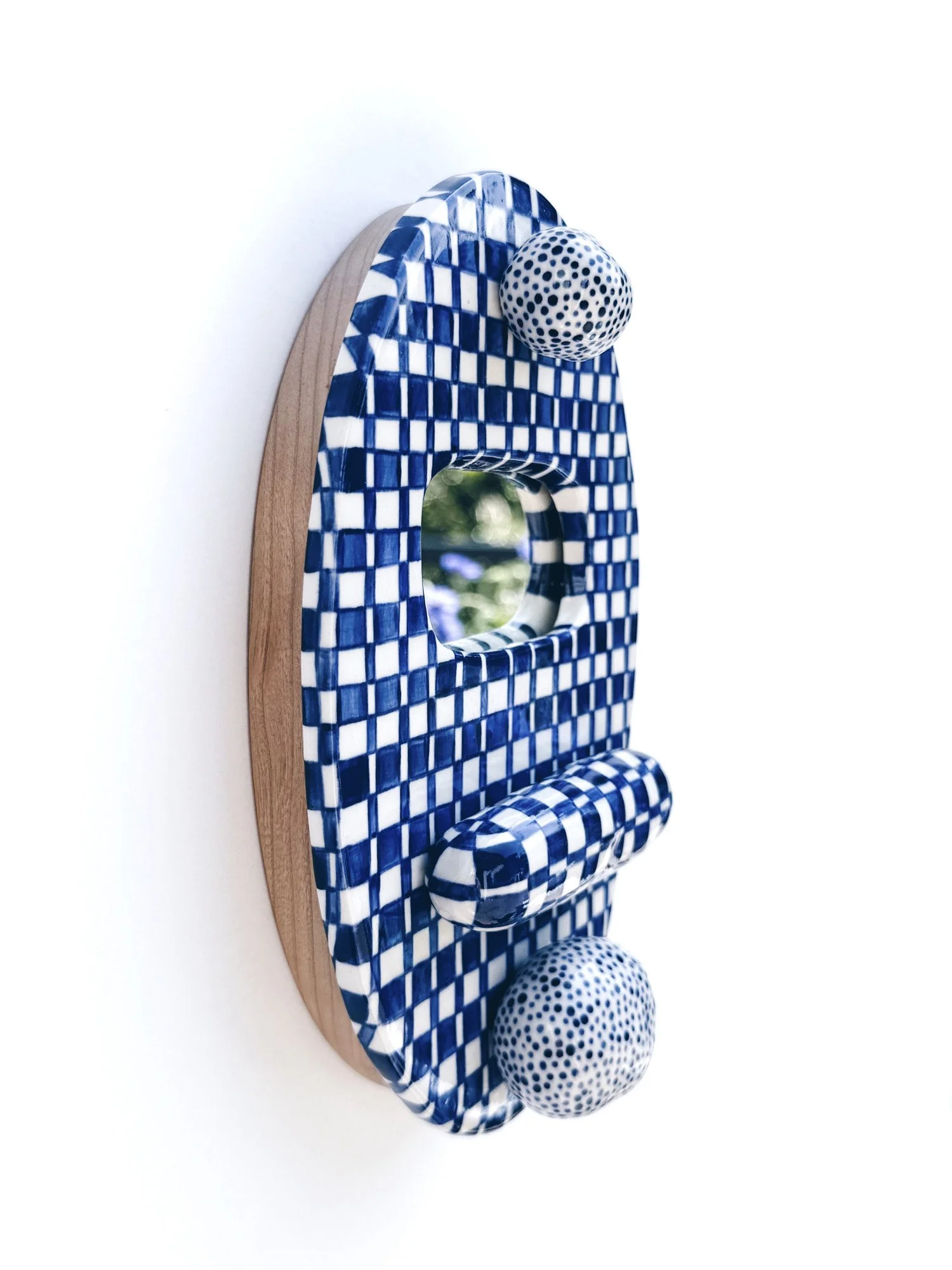 Blue and white, handmade ceramic mirror.