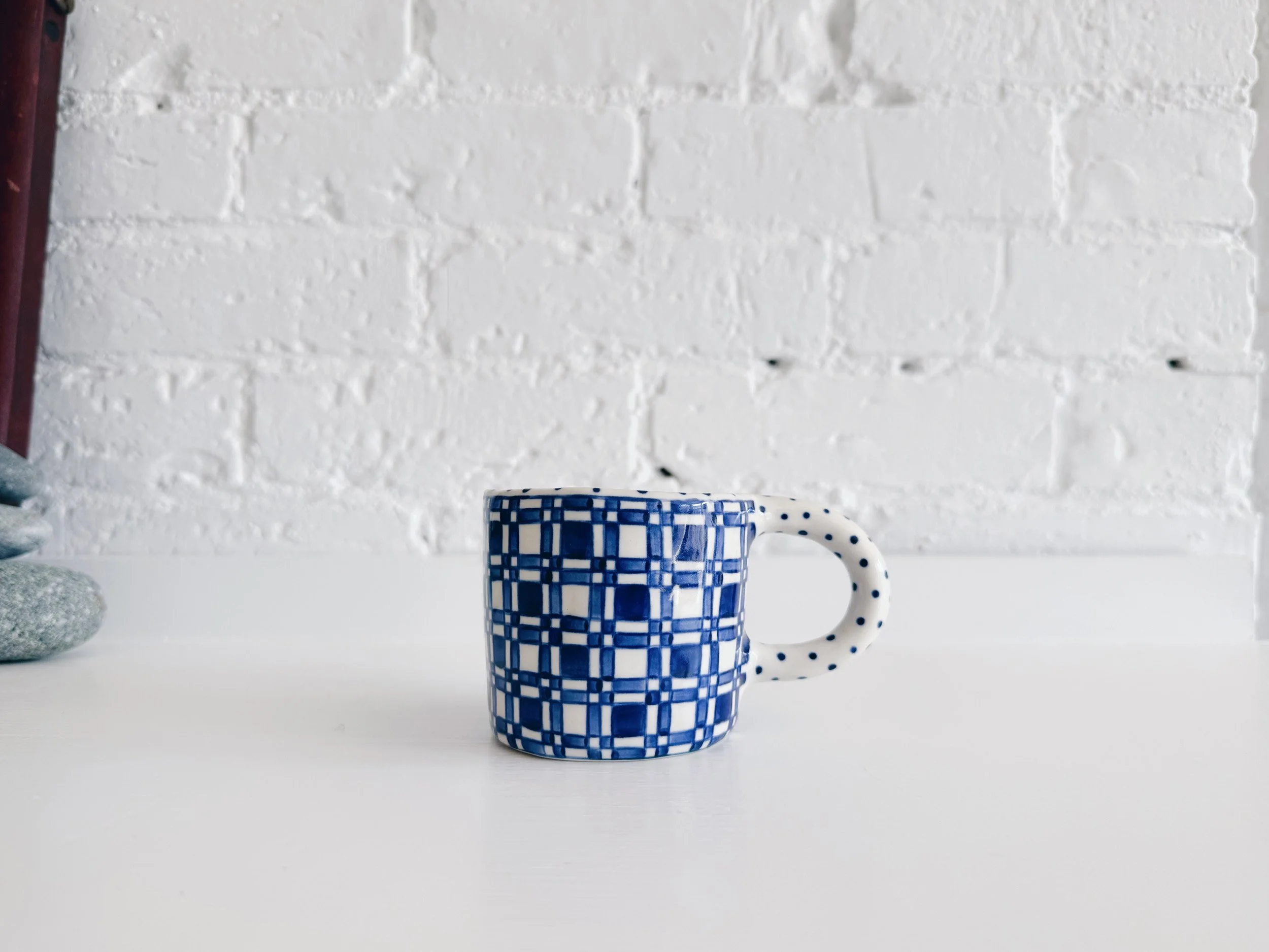 Blue and white, handmade ceramic mug.