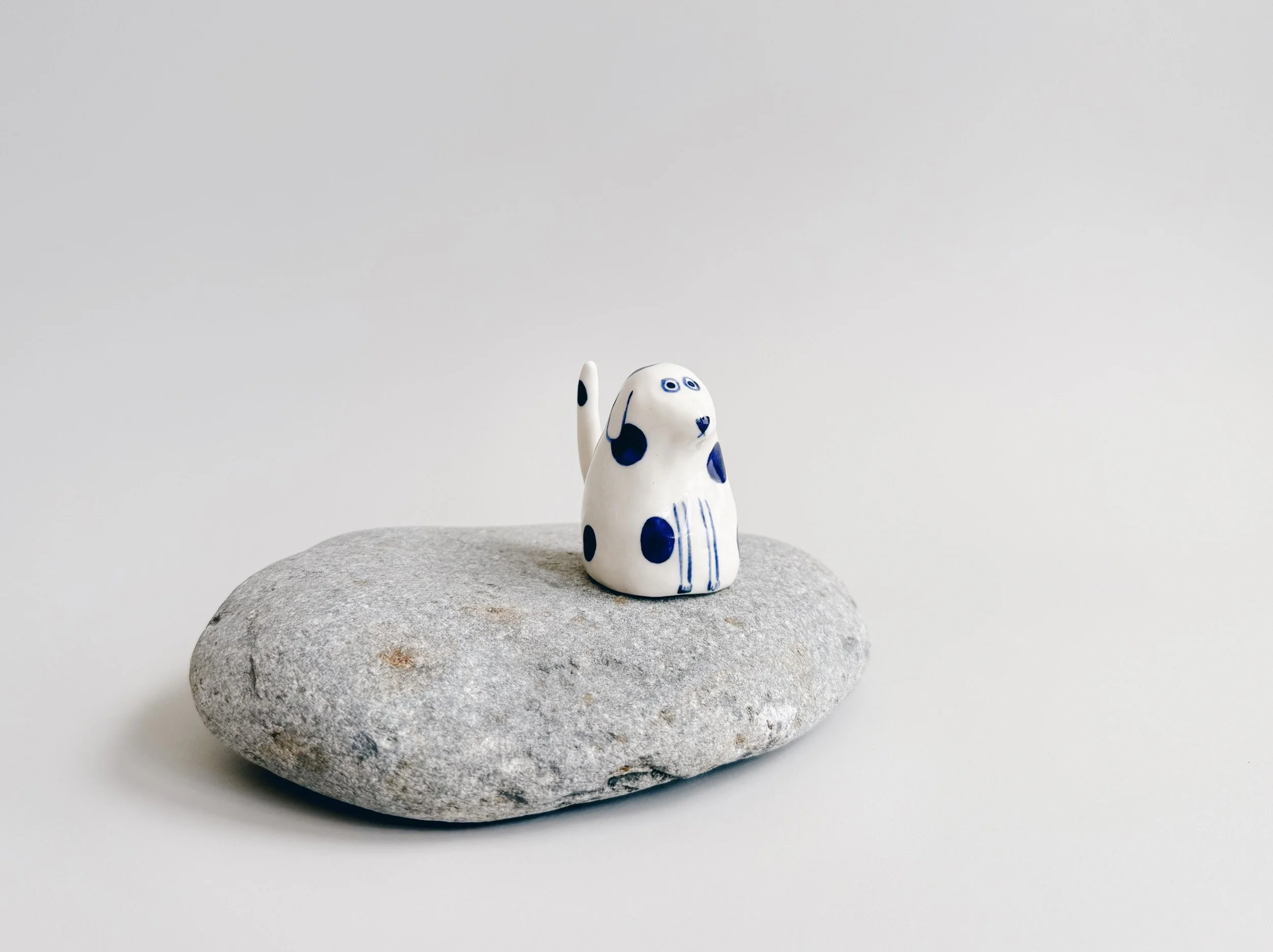 Blue and white, handmade ceramic dog.