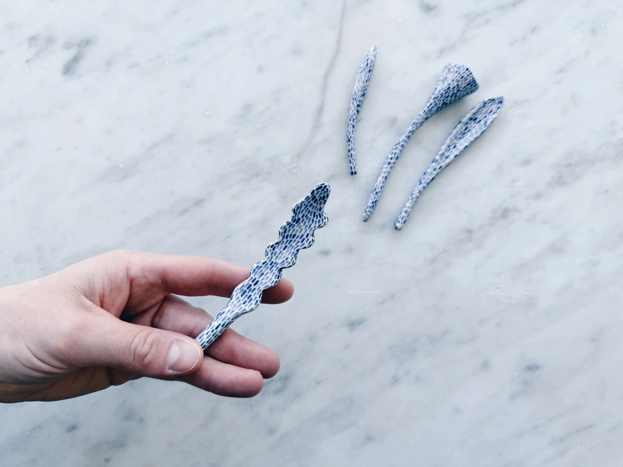 Blue and white, handmade ceramic sculpture.