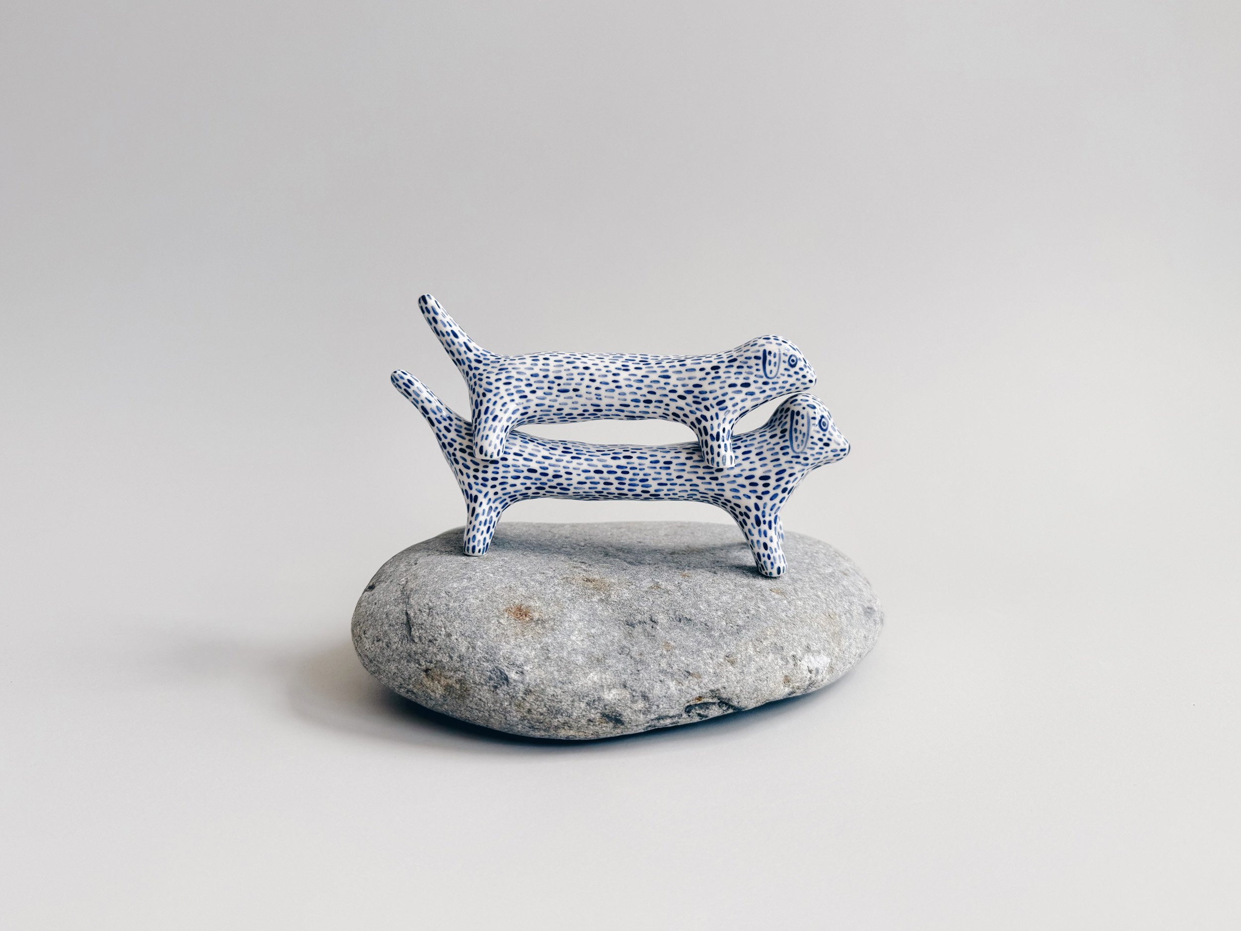 Blue and white, handmade ceramic dog.