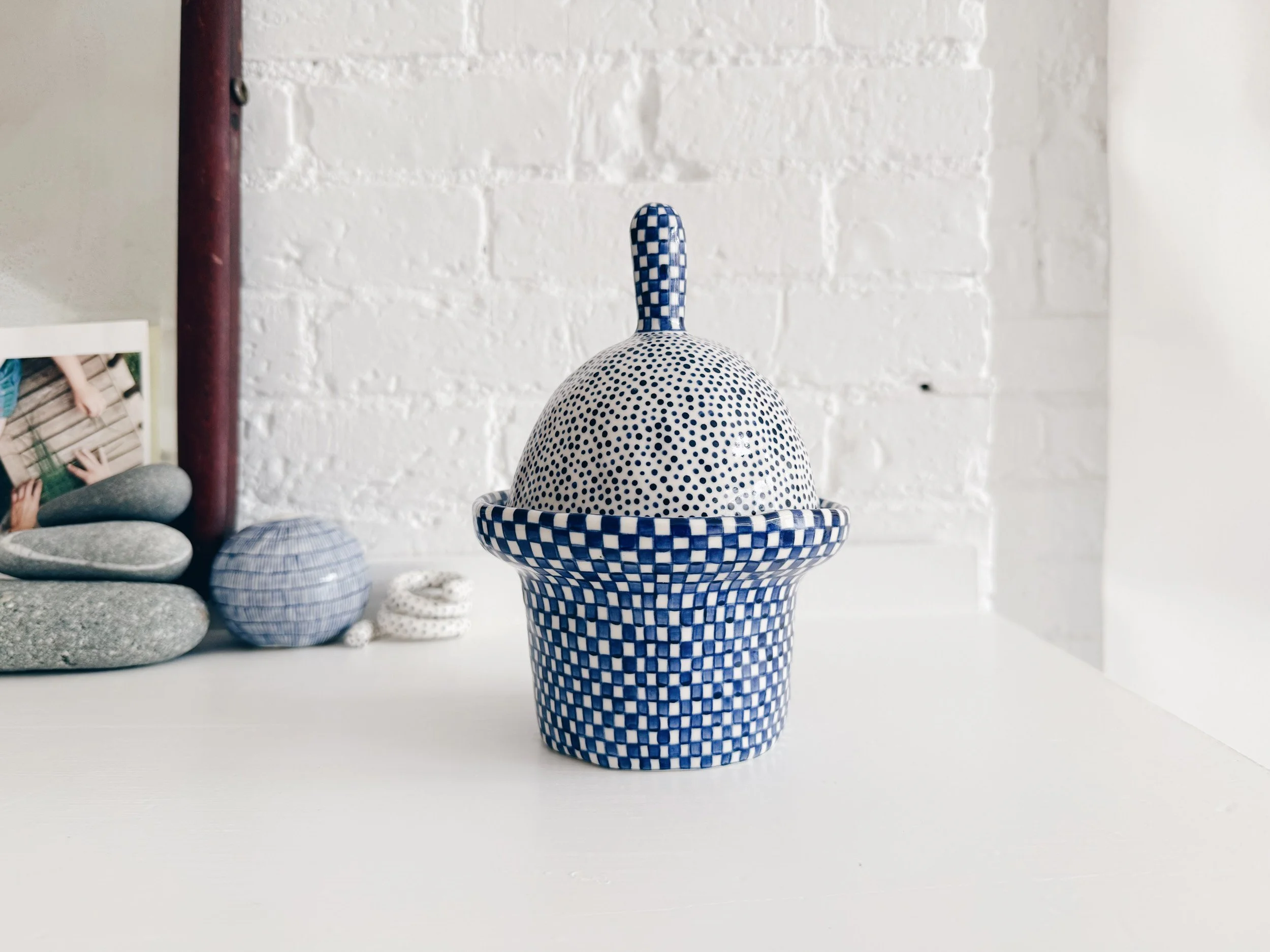 Blue and white, handmade ceramic jar.