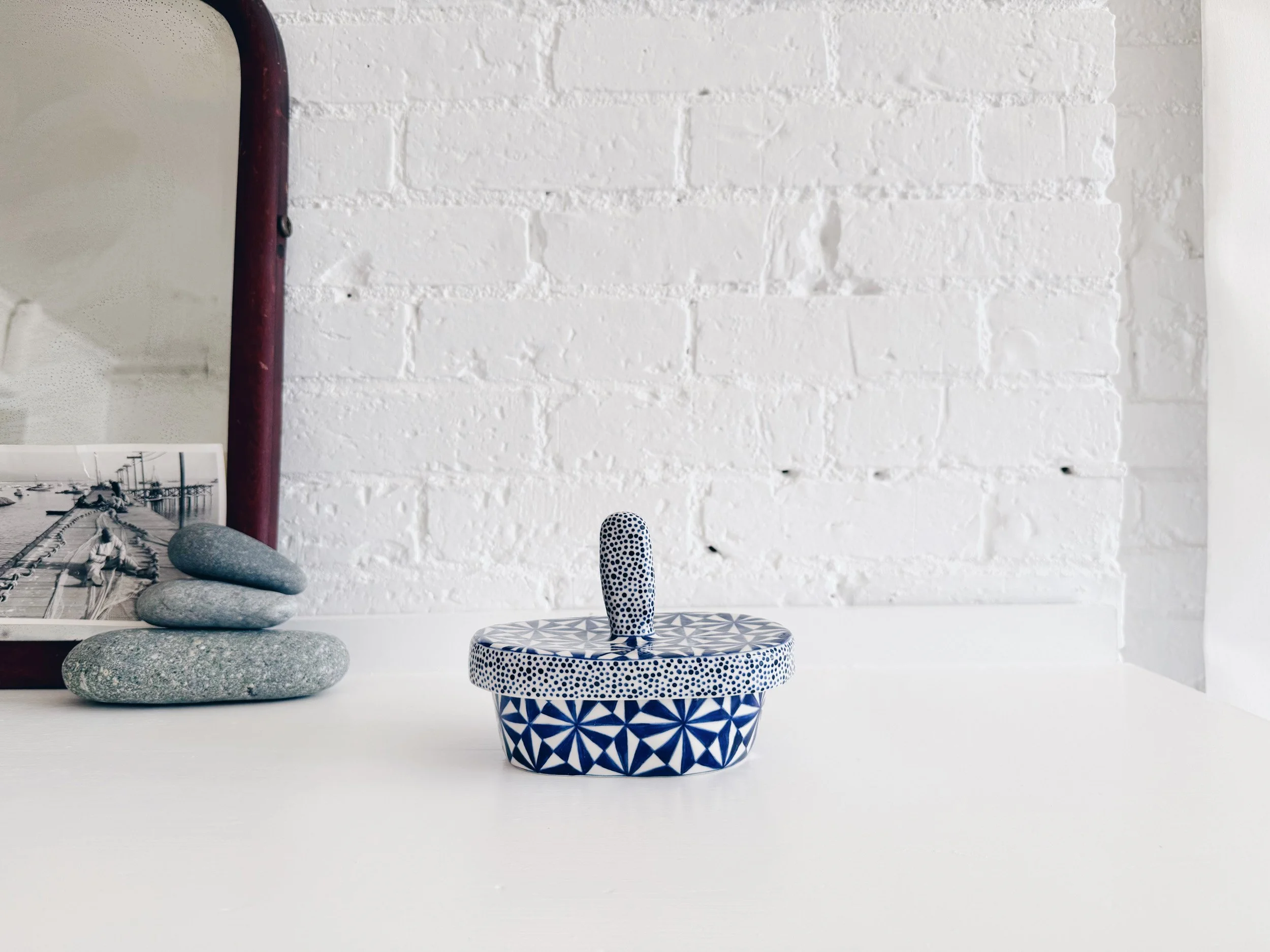 Blue and white, handmade ceramic jar.