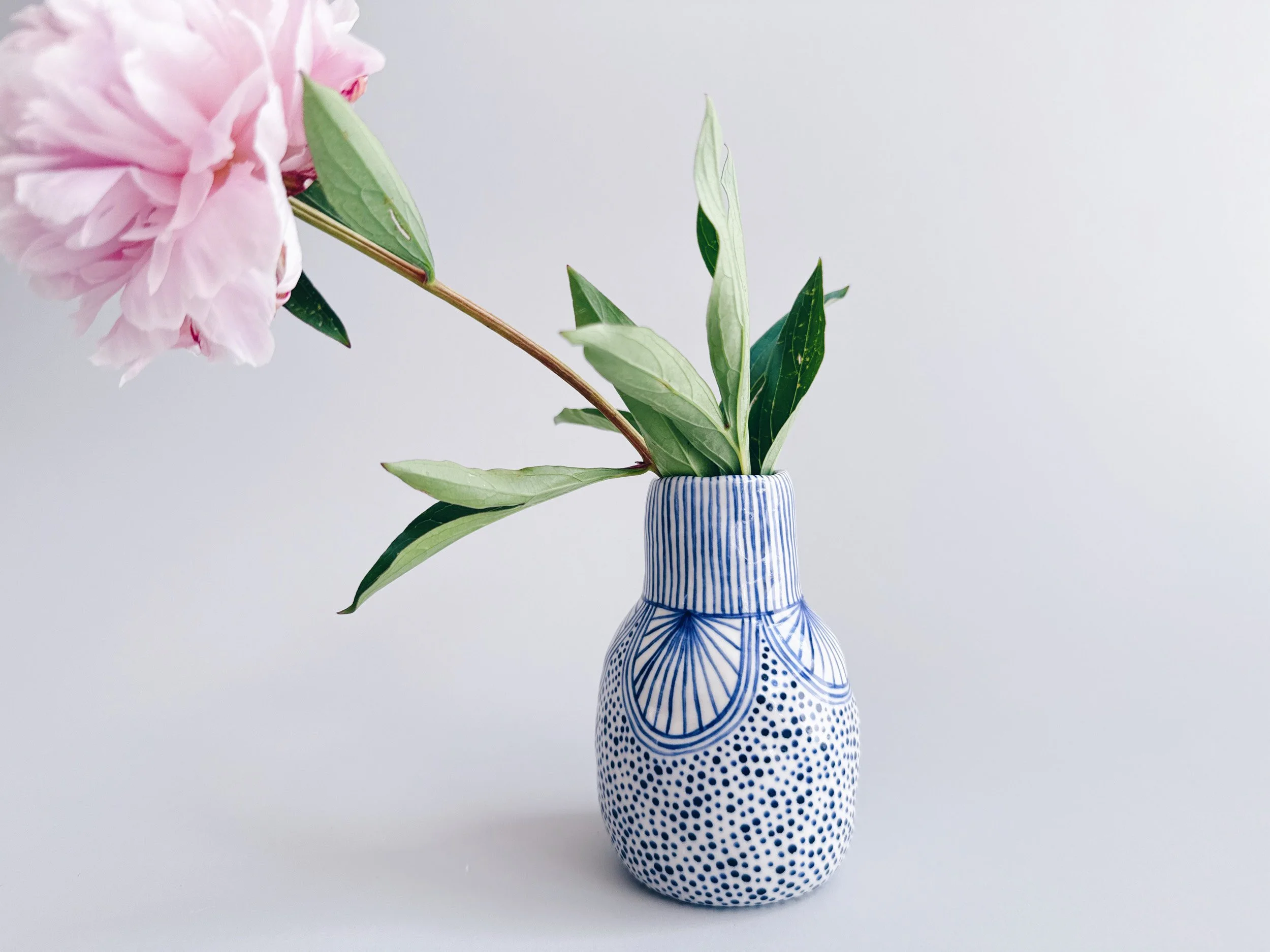 Blue and white, handmade ceramic vase.