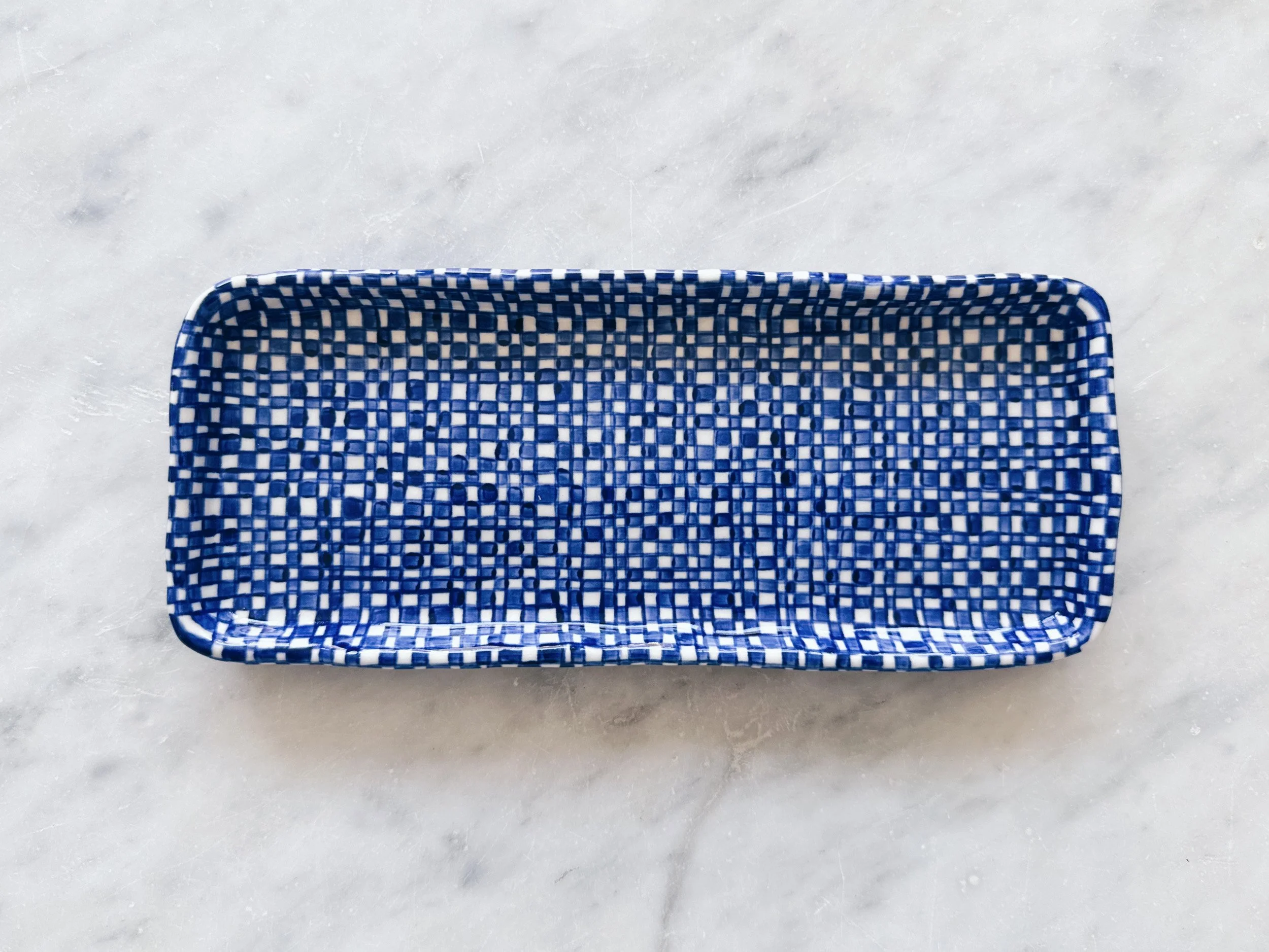 Blue and white, handmade ceramic plate.