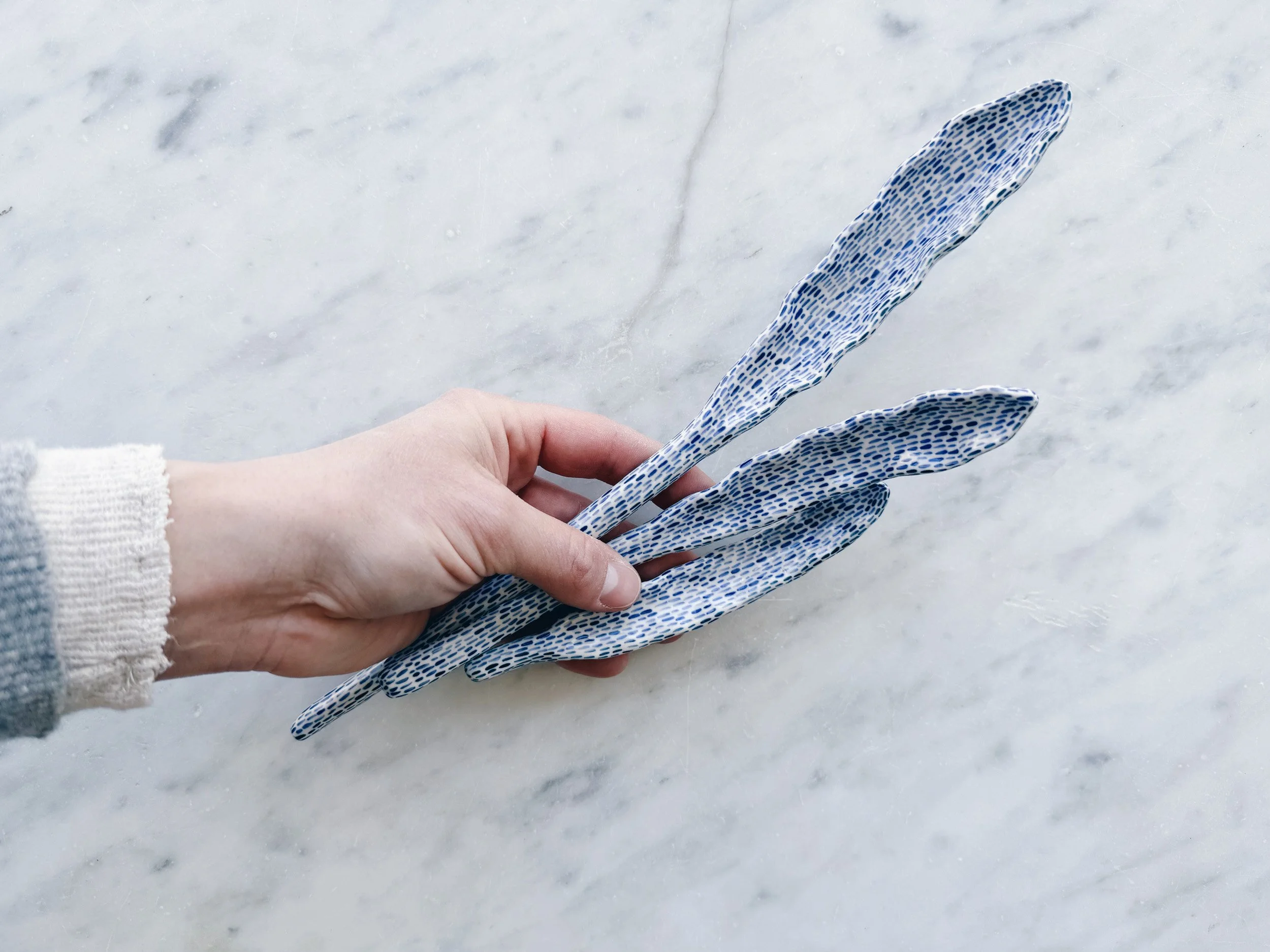 Blue and white, handmade ceramic sculpture.