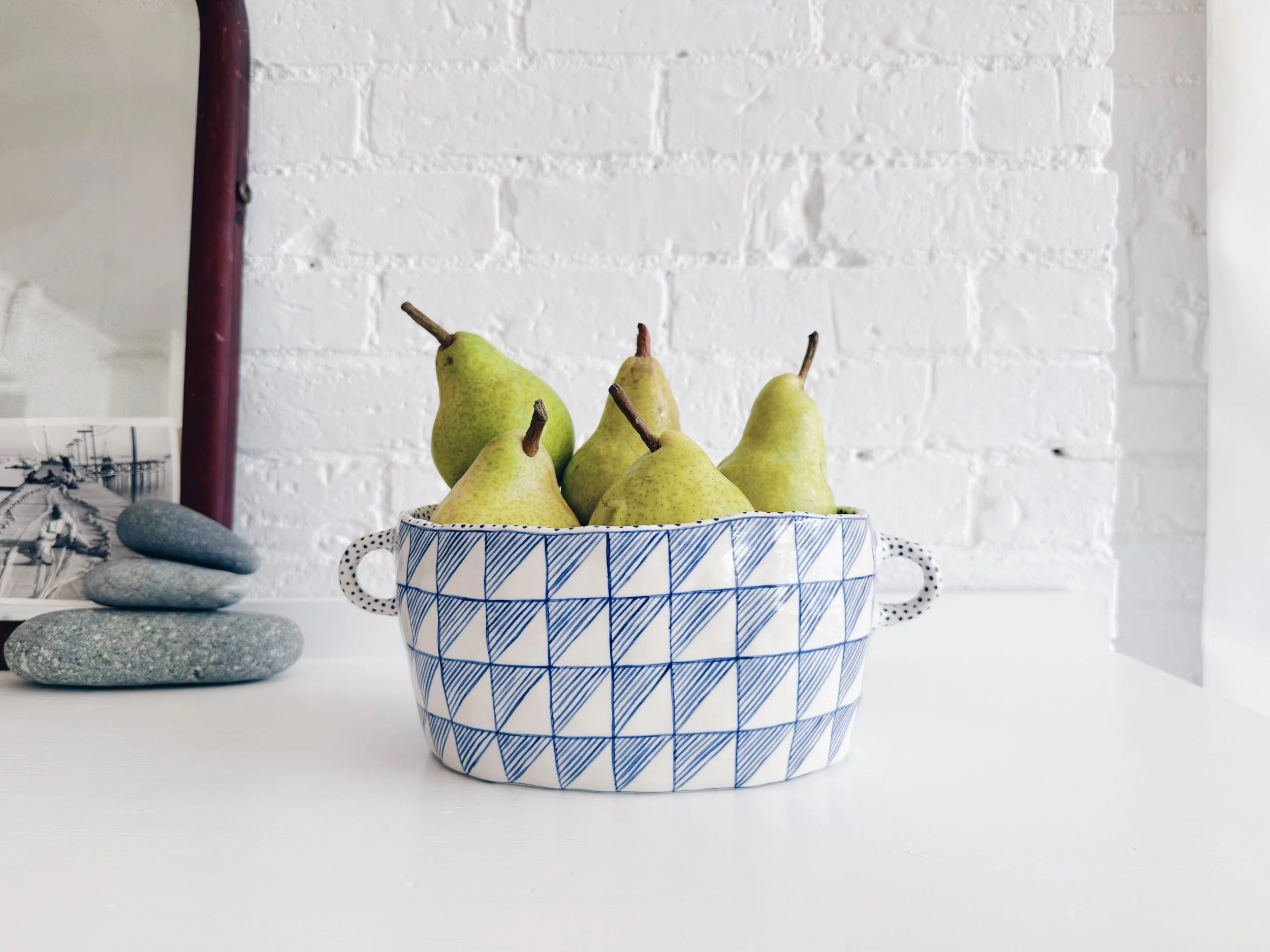Blue and white, handmade ceramic vessel.