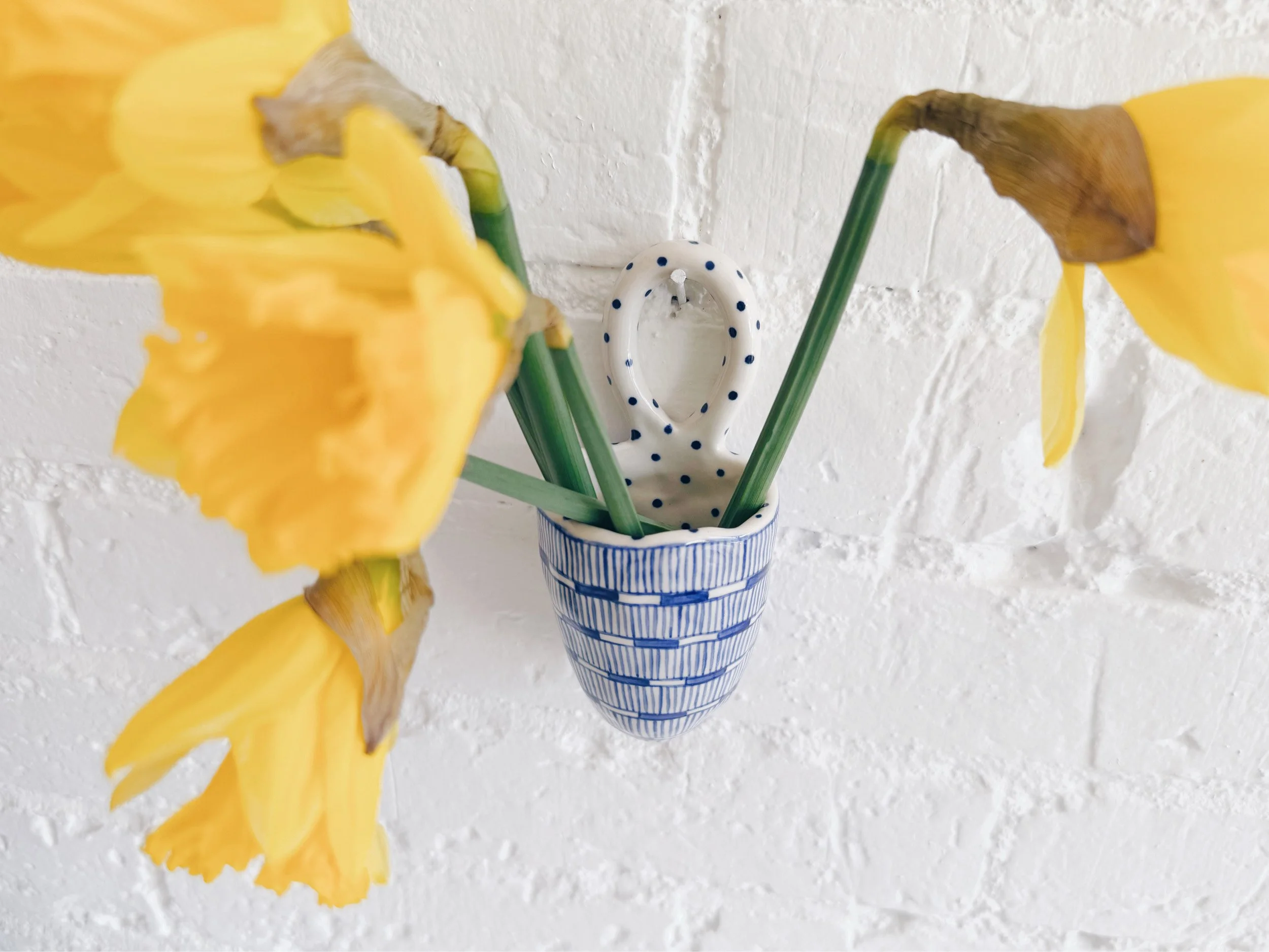 Blue and white, handmade ceramic vessel.