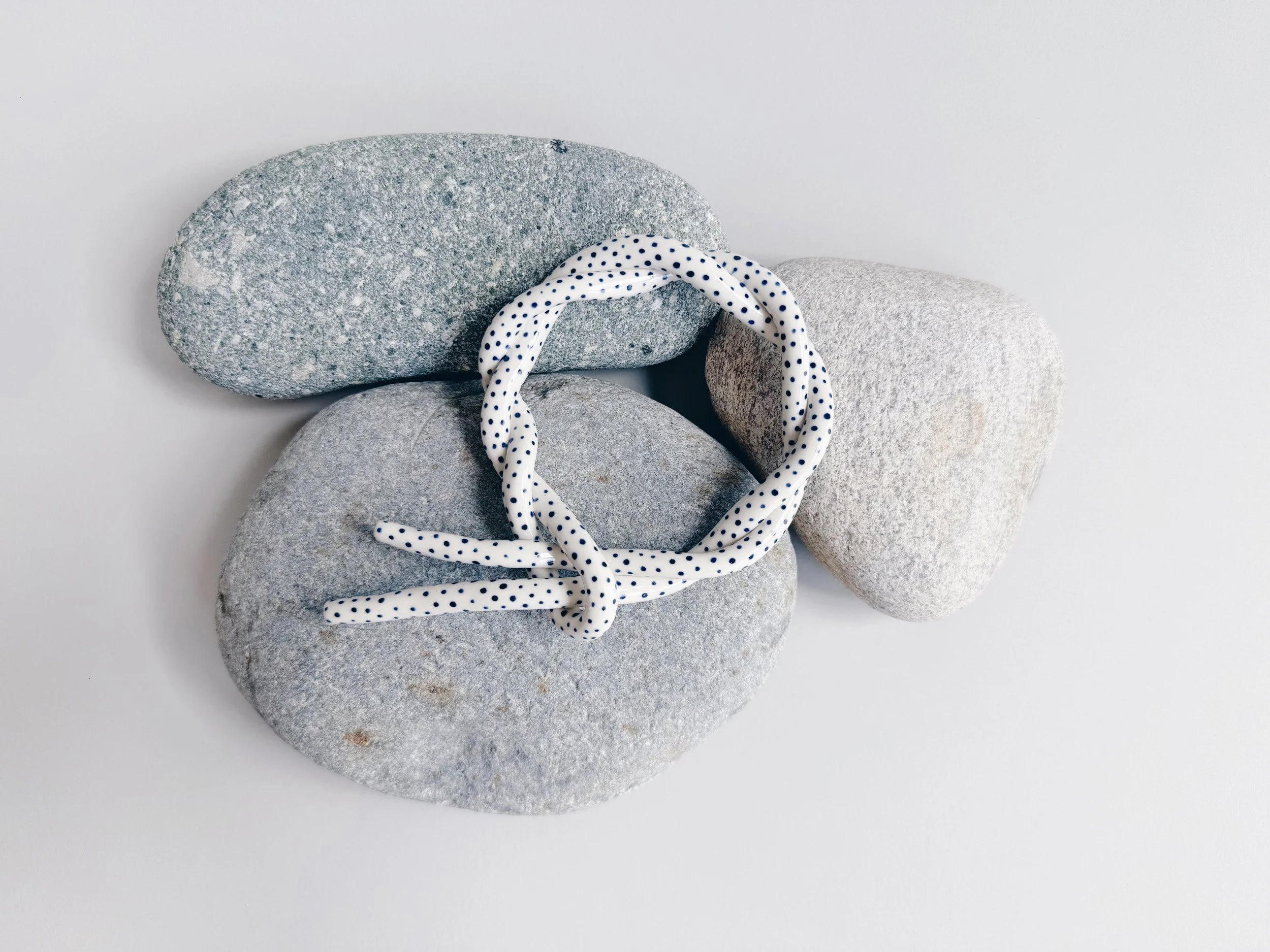 Blue and white, handmade ceramic squiggle