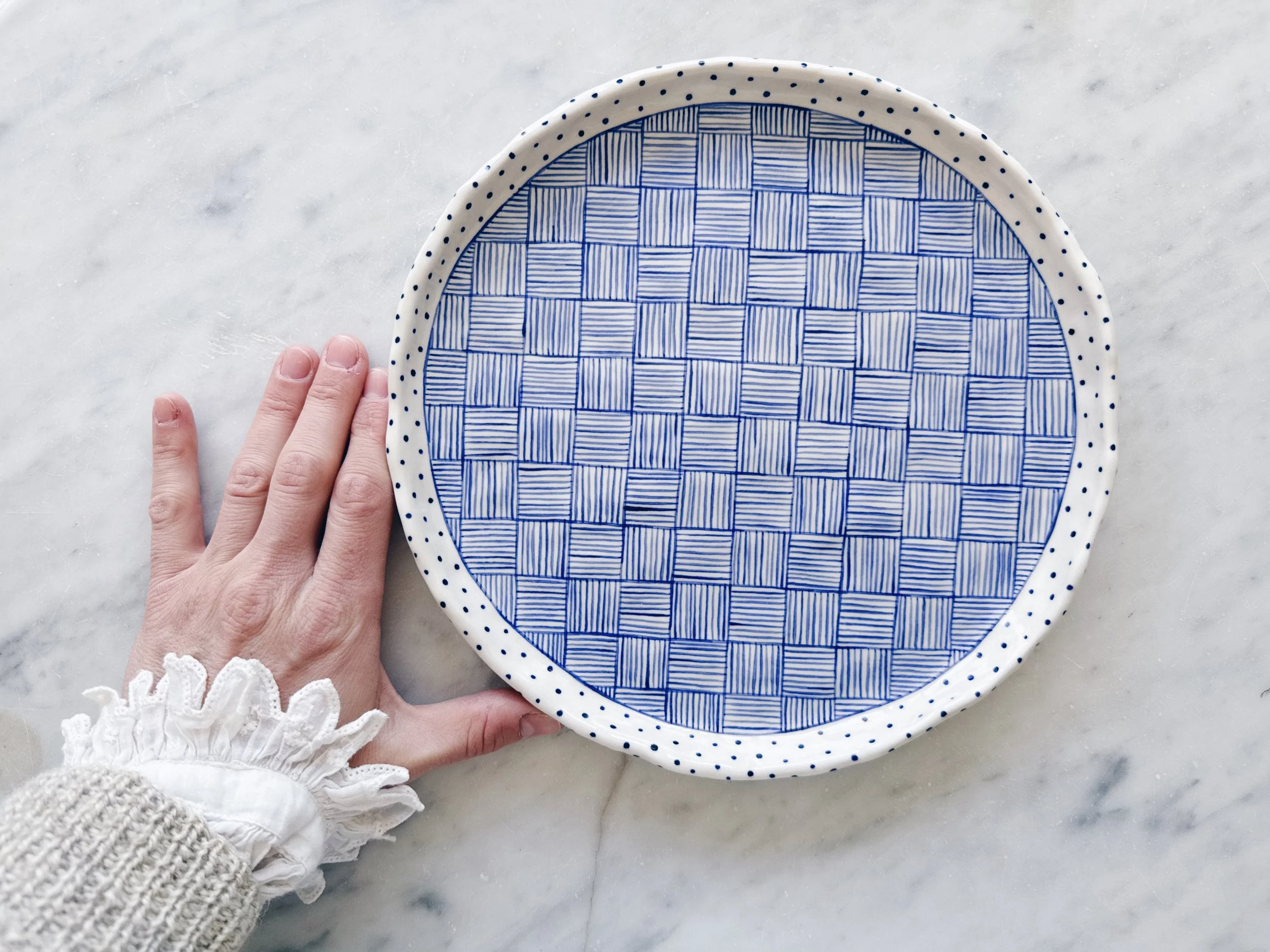Blue and white, handmade ceramic plate.
