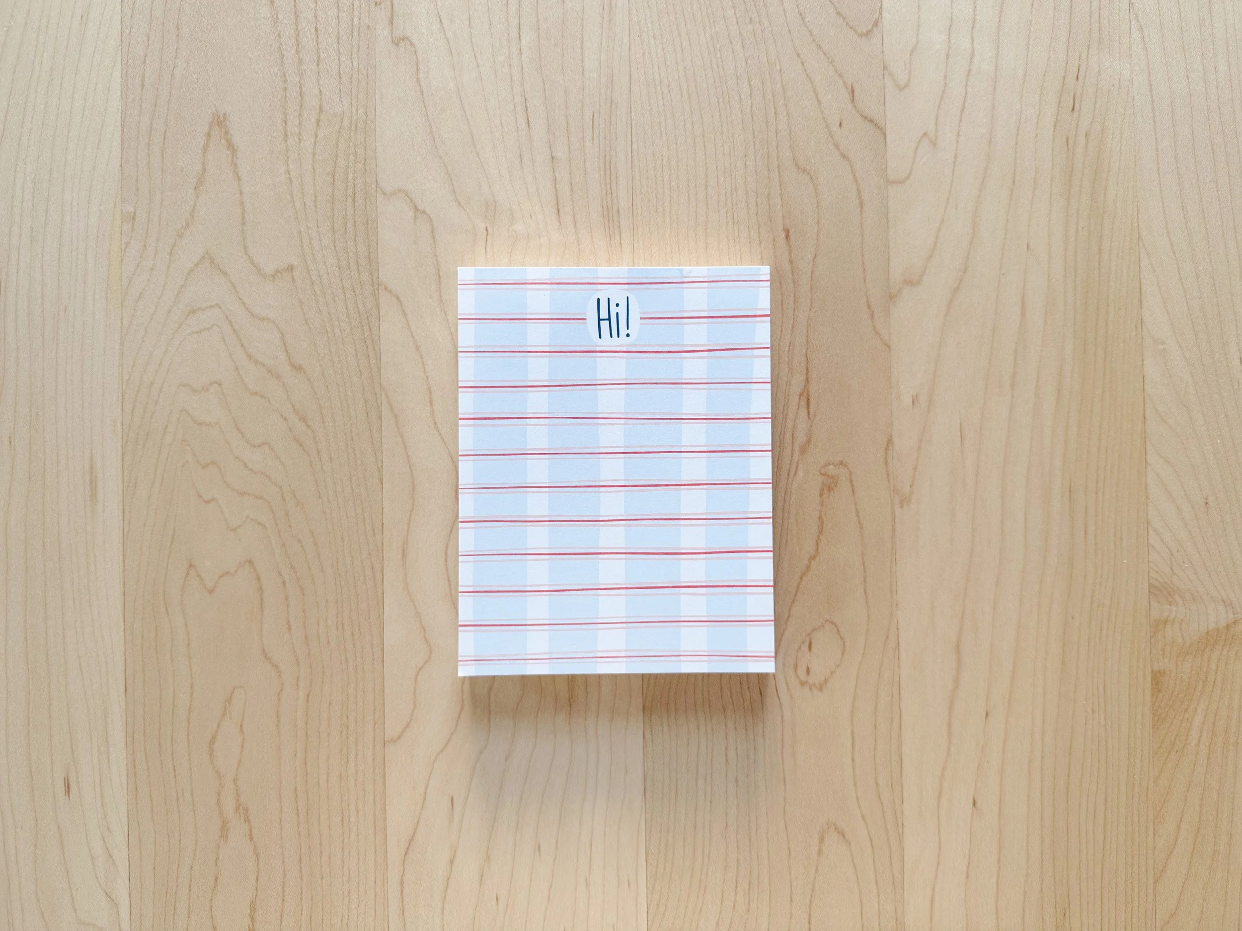 Notepad with blue and white plaid design