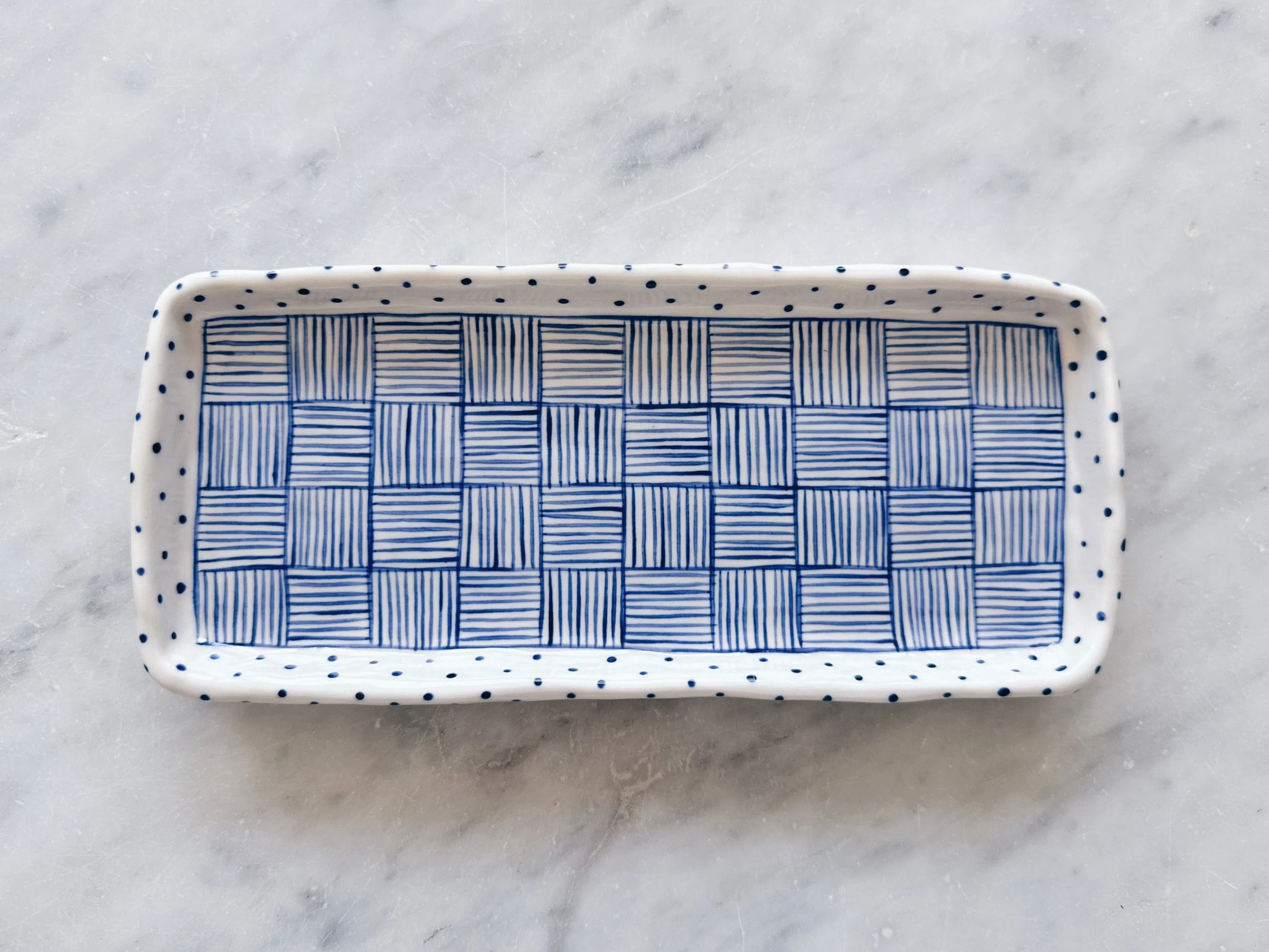 Blue and white, handmade ceramic plate.