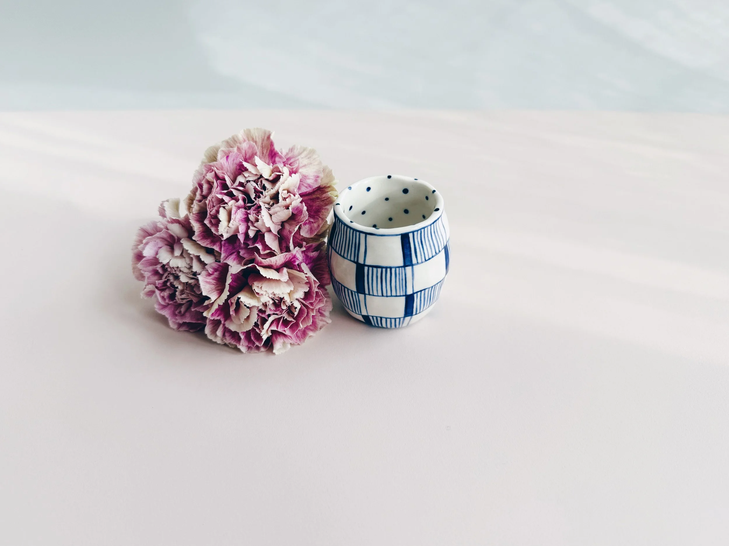 Blue and white, handmade ceramic vase.