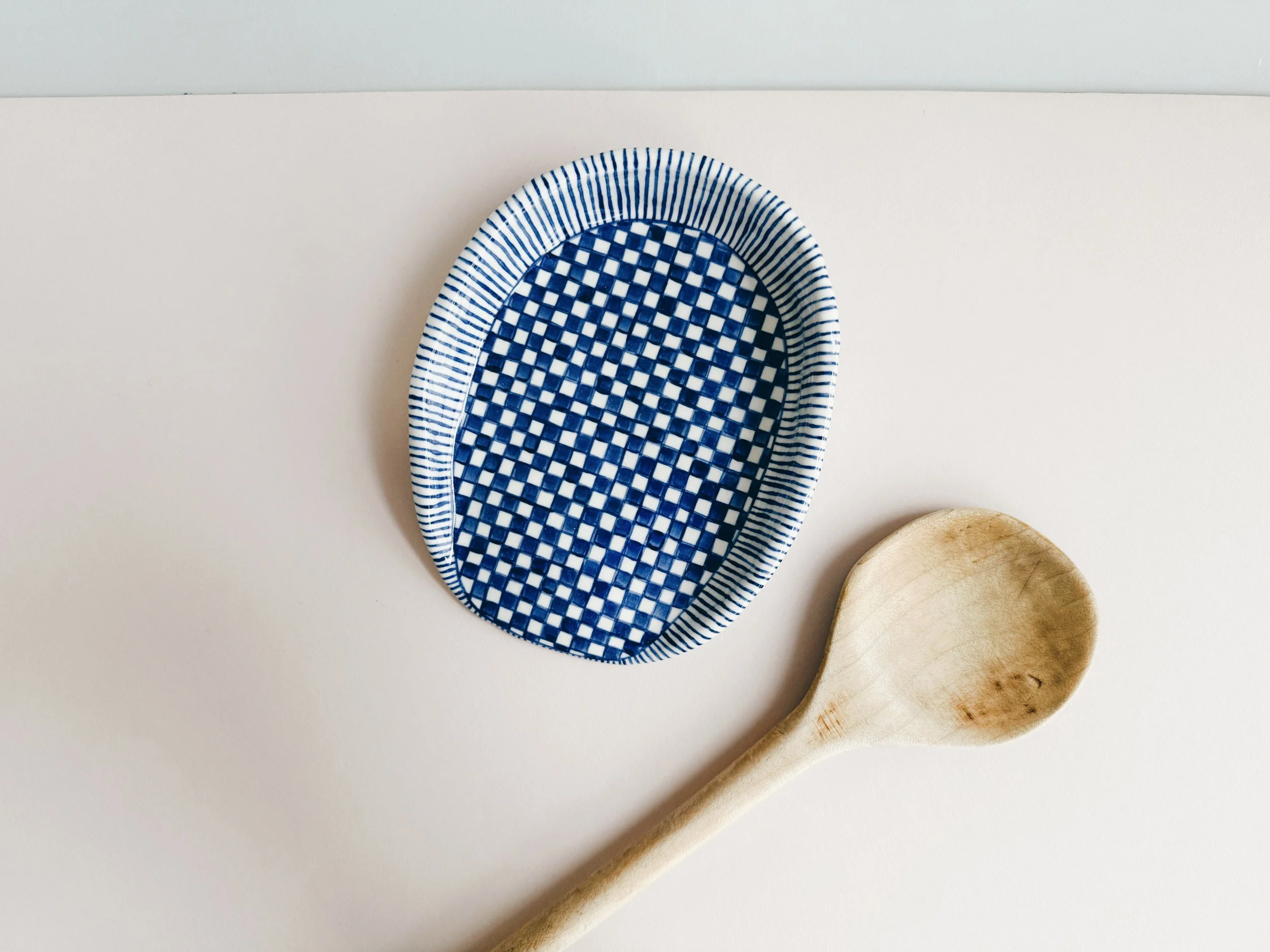 Blue and white, handmade ceramic spoon rest.