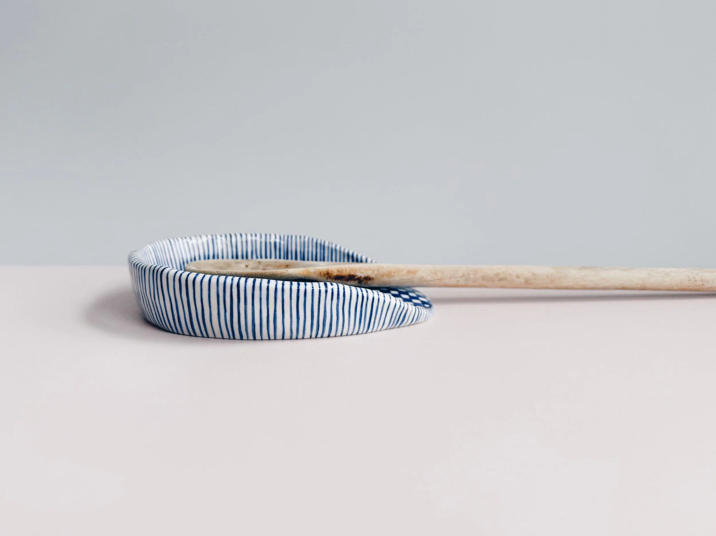Blue and white, handmade ceramic spoon rest.