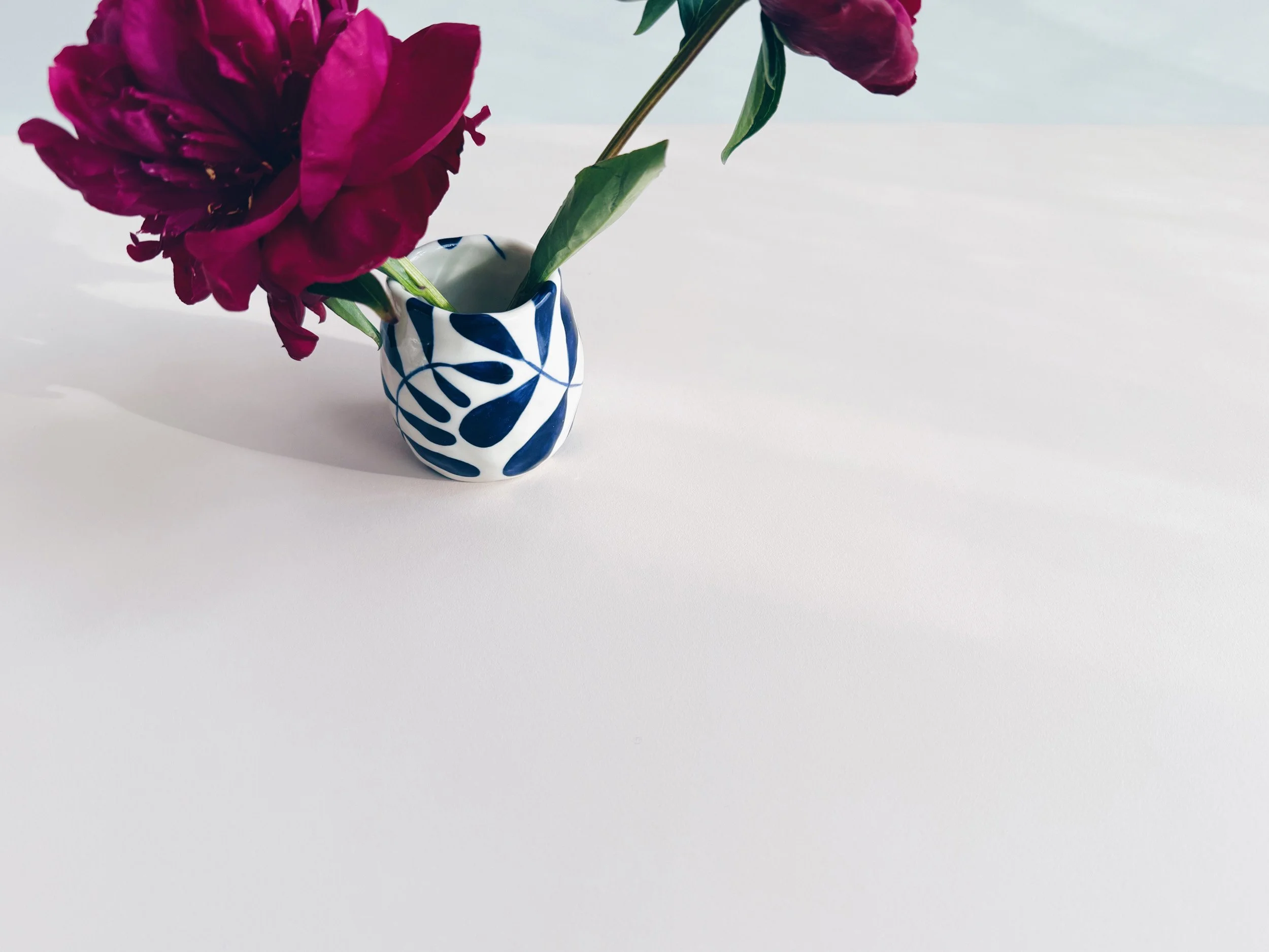 Blue and white, handmade ceramic vase.