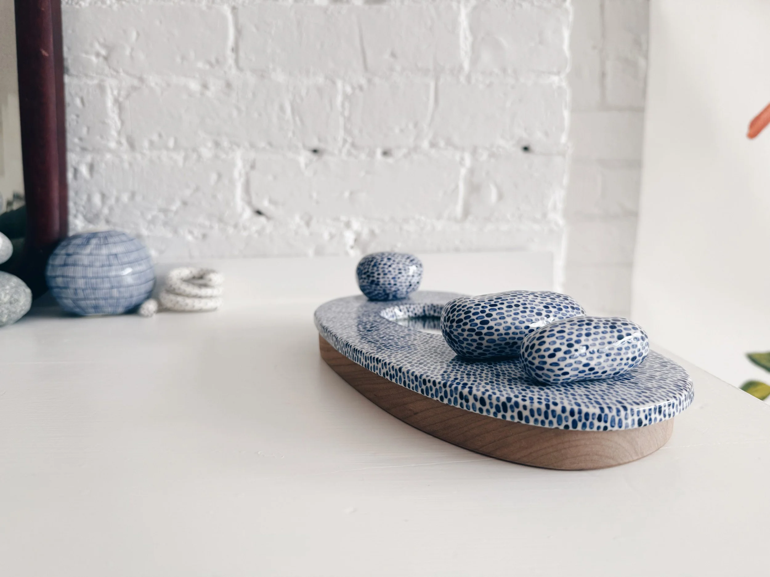 Blue and white, handmade ceramic mirror.