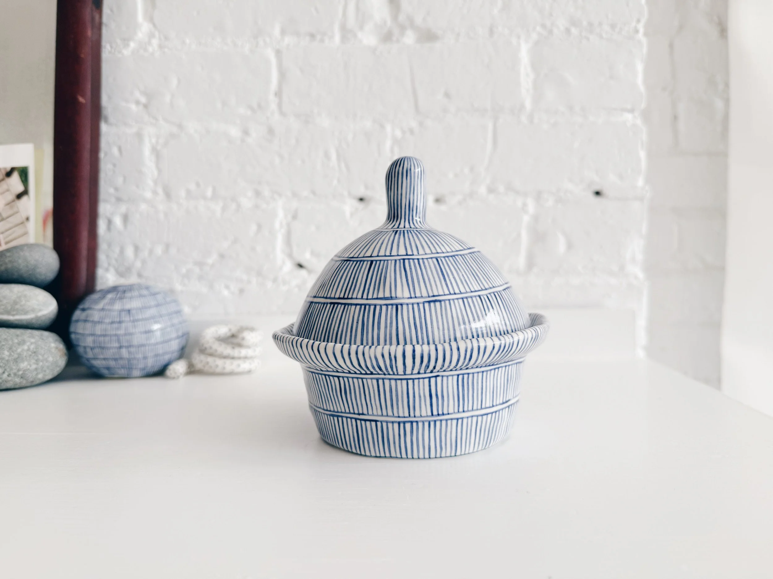 Blue and white, handmade ceramic jar.