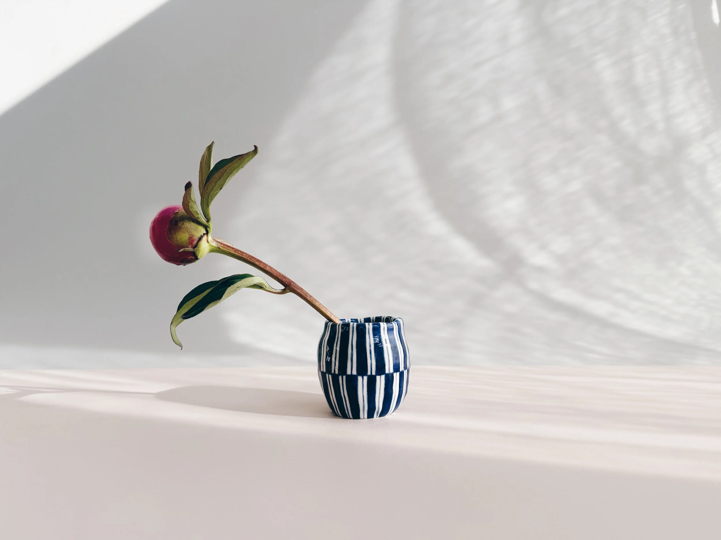 Blue and white, handmade ceramic vase.