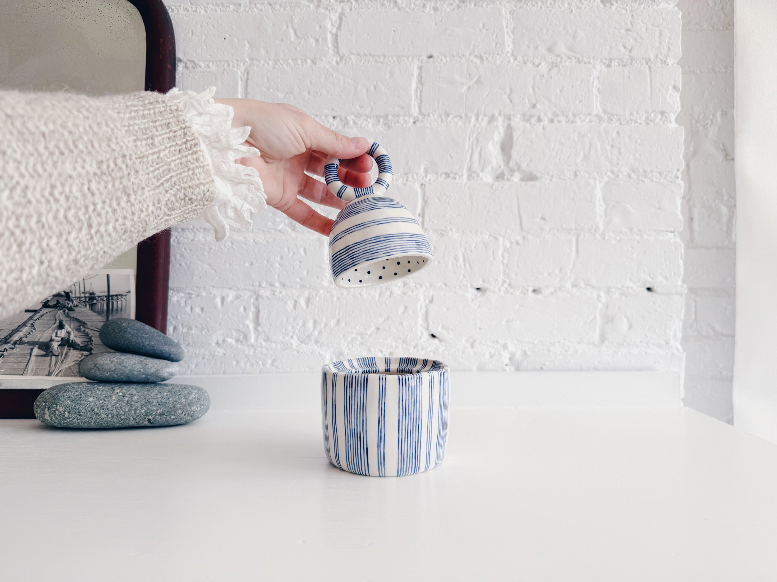 Blue and white, handmade ceramic jar.