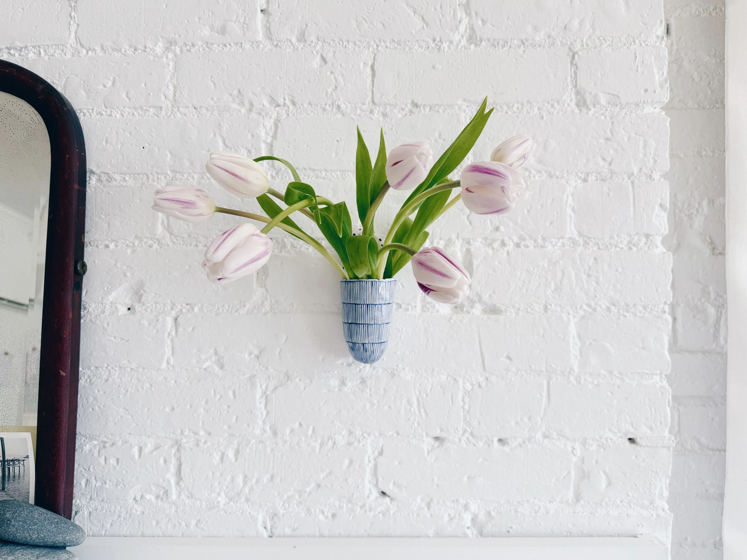 Blue and white, handmade ceramic vessel.