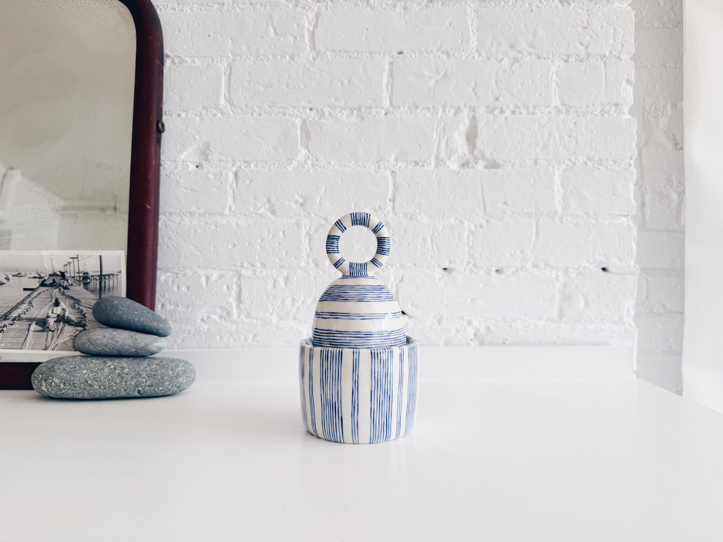 Blue and white, handmade ceramic jar.