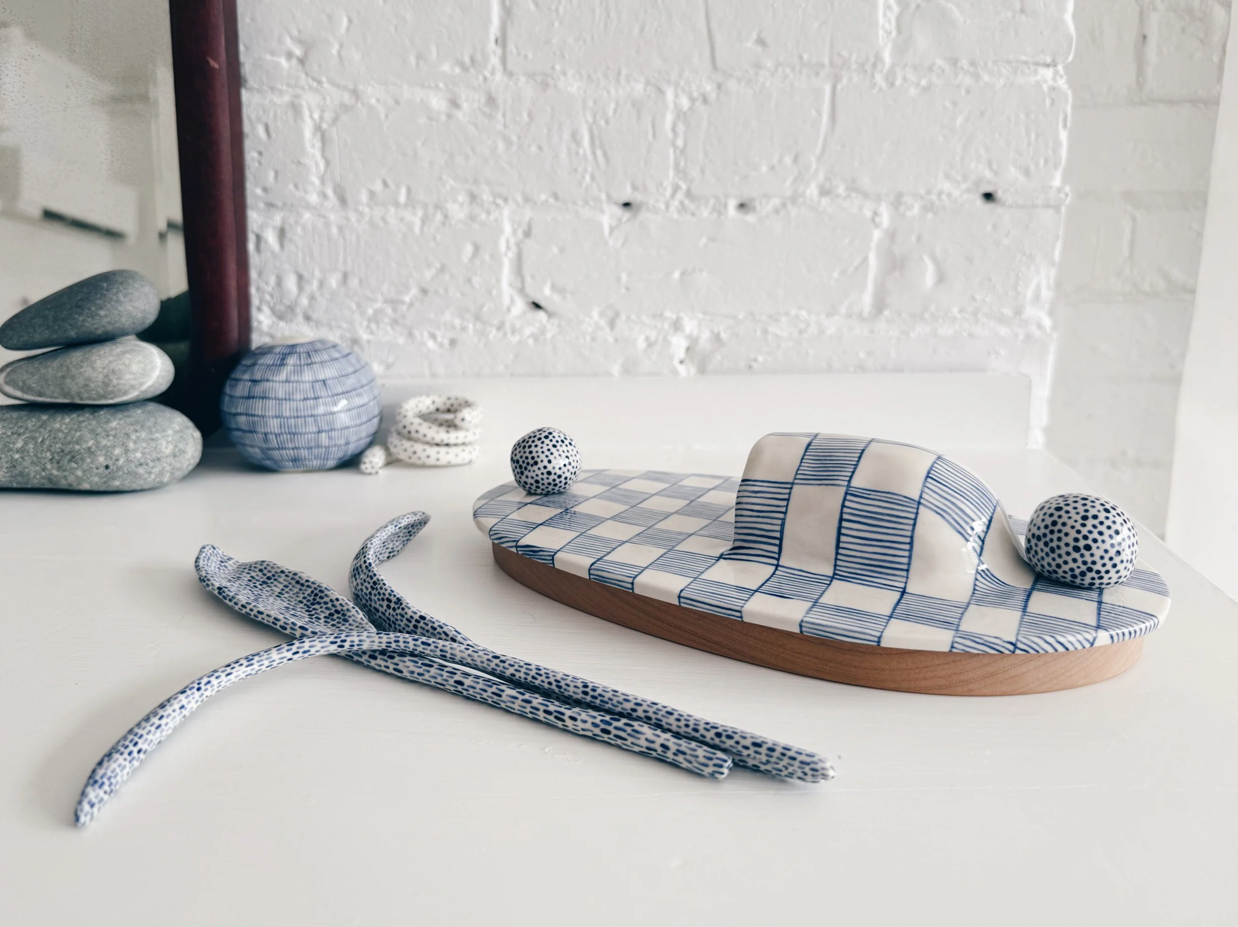 Blue and white, handmade ceramic wall hanging.