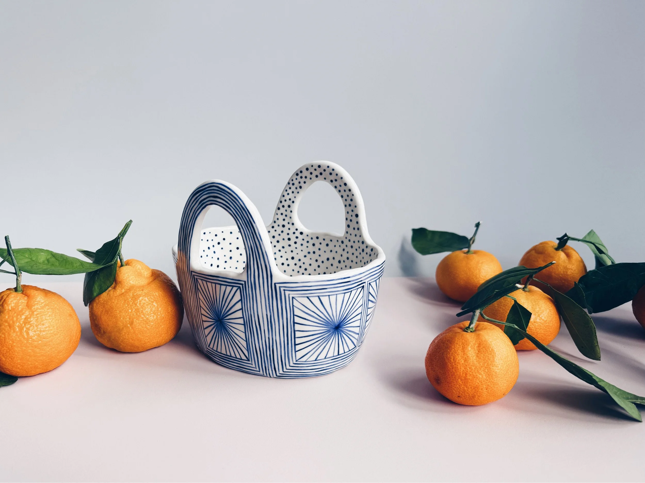 Blue and white, handmade ceramic vessel.