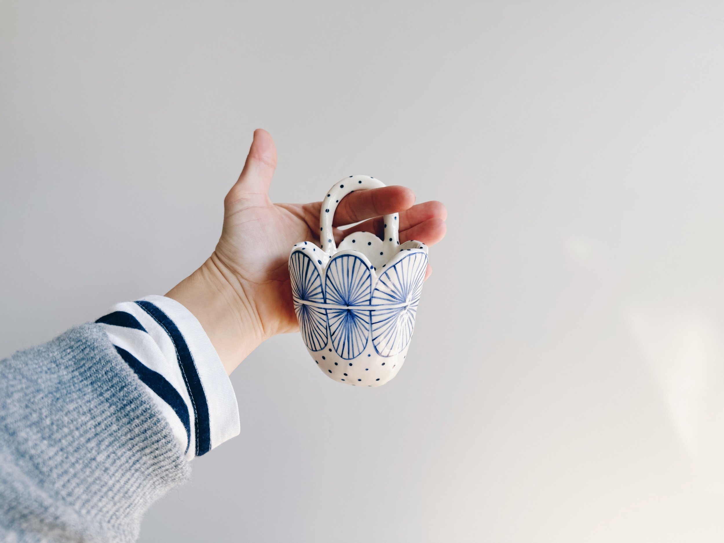 Blue and white, handmade ceramic vessel.