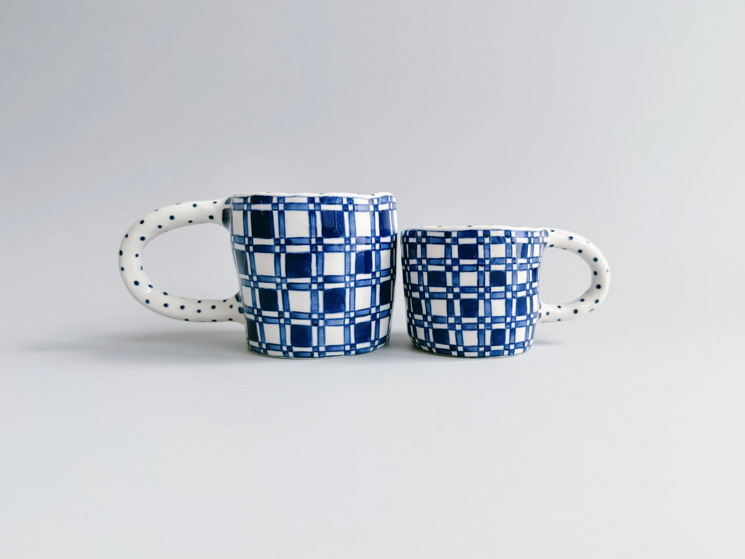 Blue and white, handmade ceramic mug.