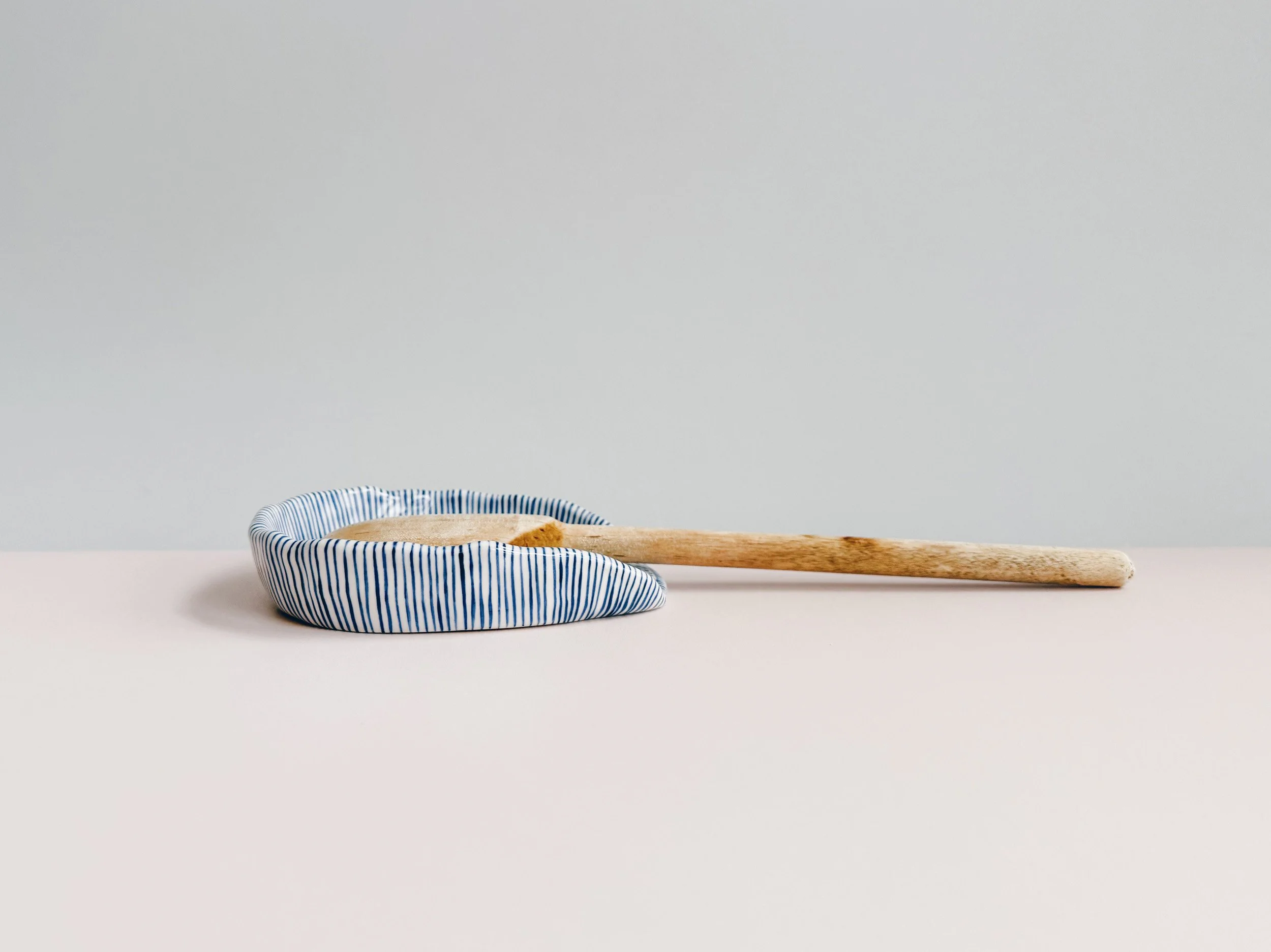 Blue and white, handmade ceramic spoon rest.