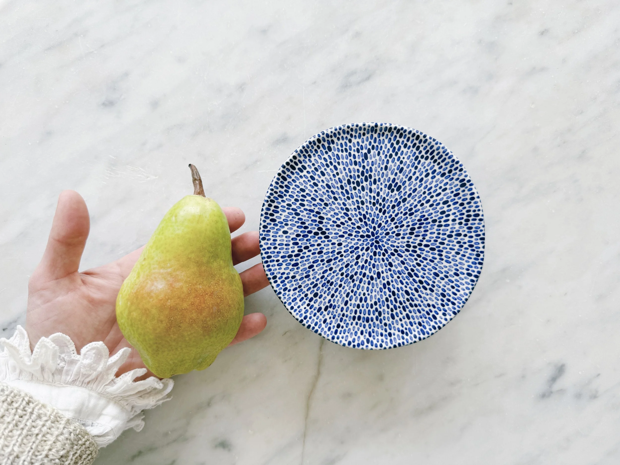 Blue and white, handmade ceramic raised plate.