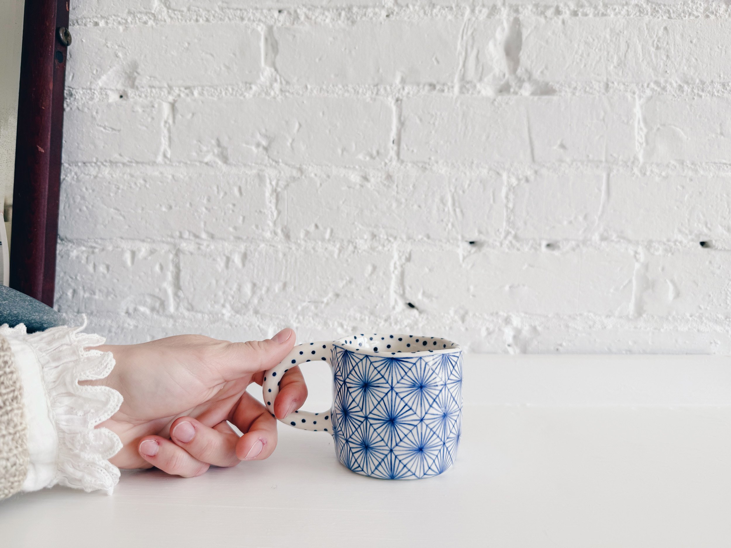 Blue and white, handmade ceramic mug.