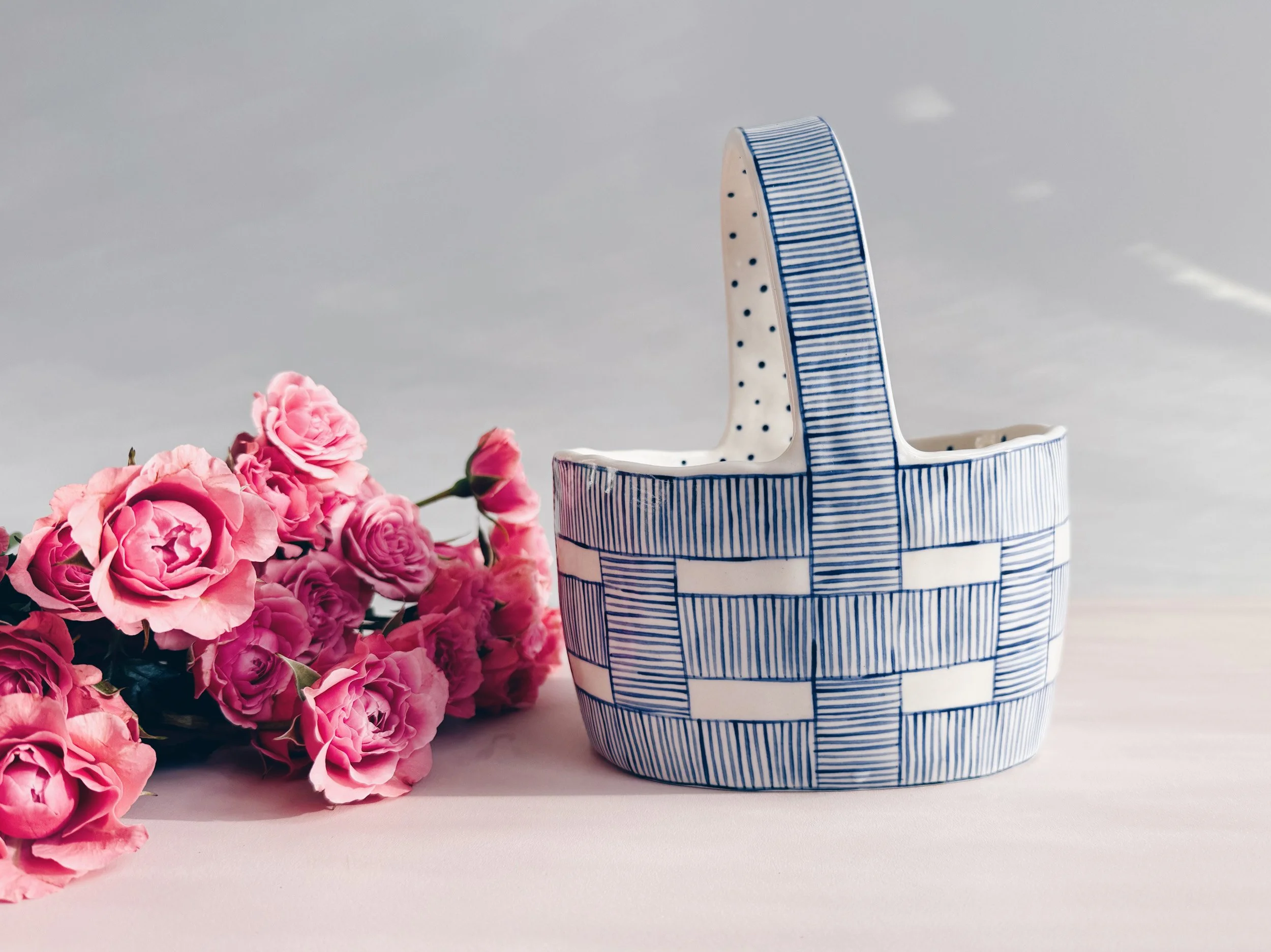 Blue and white, handmade ceramic vessel.